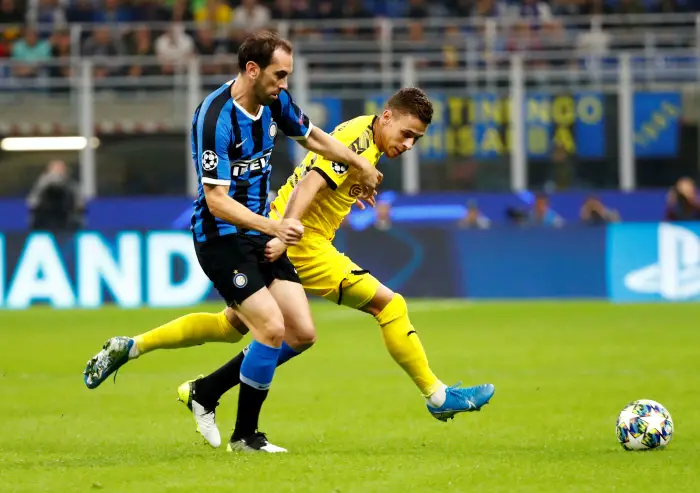 Inter Milan's Diego GoHn in aHion with Borussia Dortmund's Thorgan Hazard