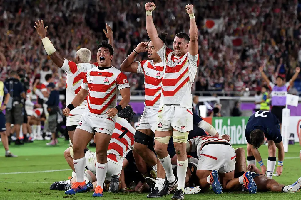 Japan's players celebrate winning the Japan 2019 Rugby World Cup Pool A match between Japan and Scotland at the International Stadium Yokohama in Yokohama on October 13, 2019. (Photo by William WEST / AFP)