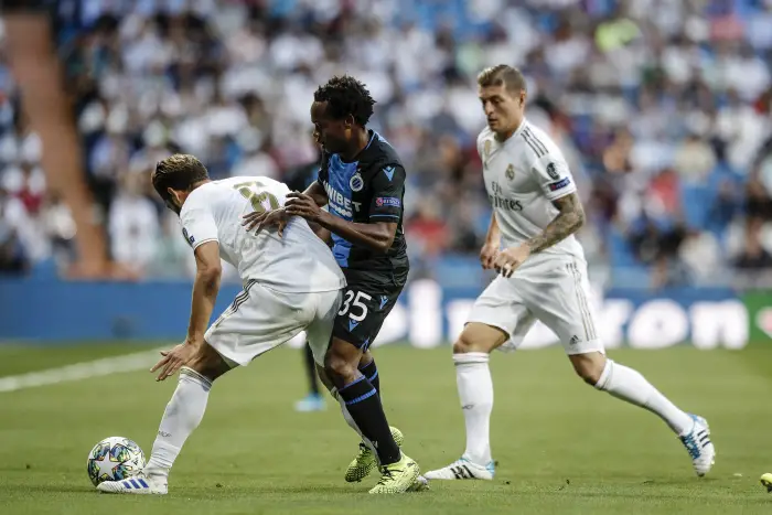 Percy Tau (Brujas KV) challenges for control of the ball with Jose I. Fernandez, NACHO (Real Madrid),   UCL Champions League match between Real Madrid vs Brujas KV at the Santiago Bernabeu stadium in Madrid, Spain, October 1, 2019 .