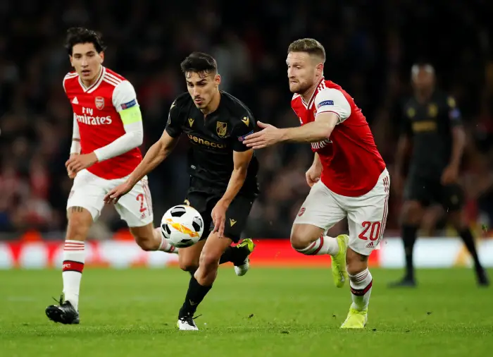 Soccer Football - EuropaHeague HGroup F - Arsenal v Vitoria S.C. - Emirates Stadium, London, Britain - October 24, 2019  Arsenal's Shkodran Mustafi fouls Vitoria's Andre Almeida and is subsequently shown a yellow card