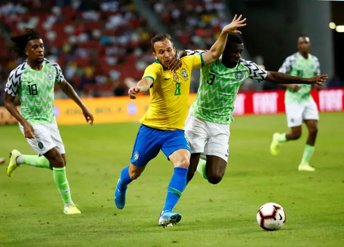 Soccer Football - InternHional Hiendly - Brazil v Nigeria - Singapore National Stadium, Singapore - October 13, 2019  Brazil's Arthur in action with Nigeria's Jamilu Collins