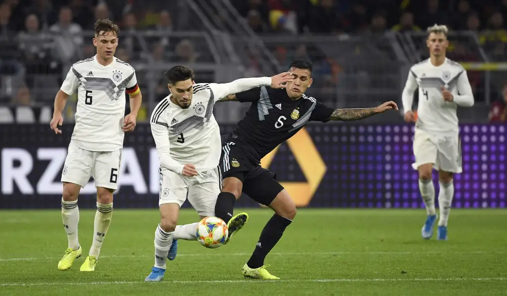 Germany's Suat Serdar and Argentina's Leandro Paredes (R) vie for the ball during a friendly soccer match between Germany v Argentina at the Signal-Iduna Park in Dortmund on October 9, 2019. (Photo by Ina FASSBENDER / AFP)