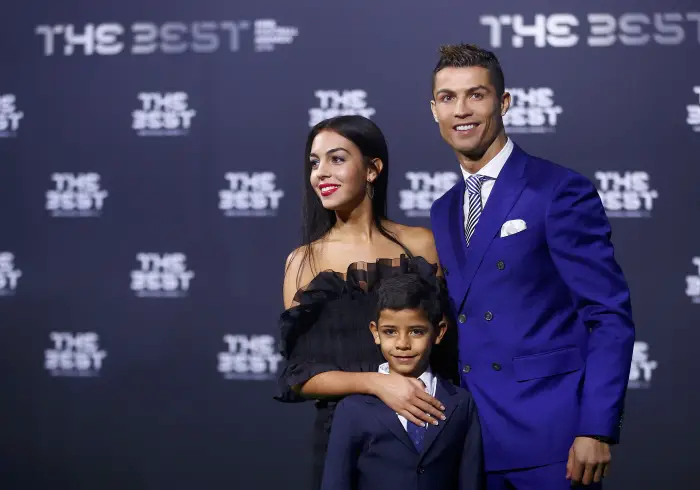 REFILE - ADDITIONAL CAPTION INFORMATION  Football Soccer - FIFA Awards Ceremony - Zurich, Switzerland - 09/01/17.  Real Madrid's Cristiano Ronaldo, his son Cristiano Ronaldo Jr and Georgina Rodriguez arrive at the ceremony.