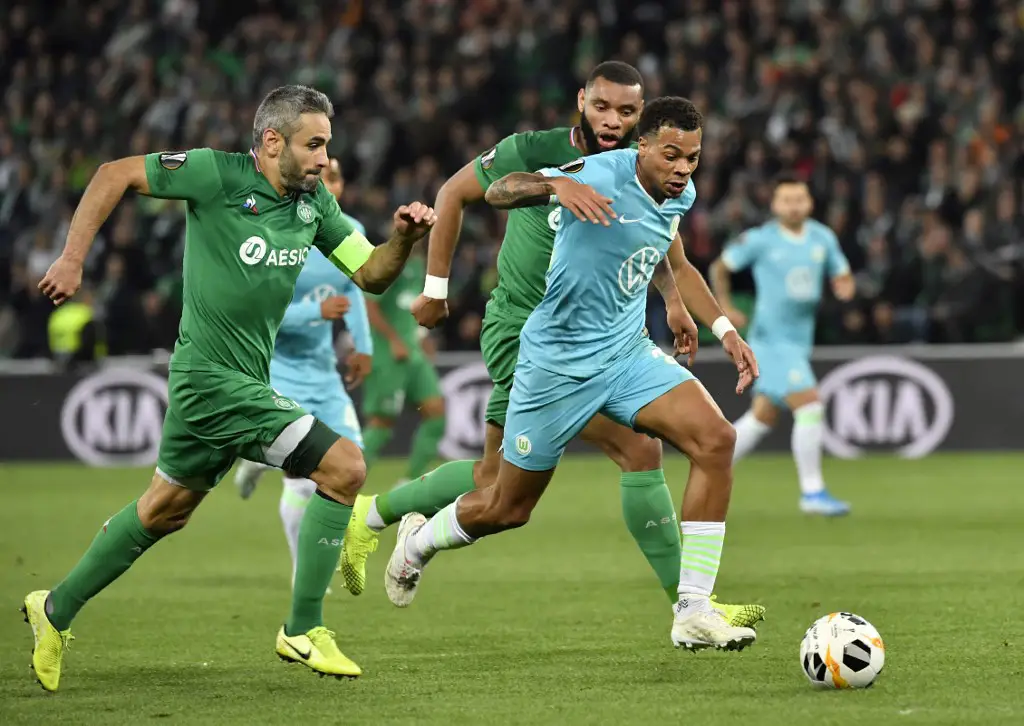 Wolfsburg's German forward Lukas Nmecha (R) vies with Saint-Etienne's French defender Harold Moukoudi (C) and Saint-Etienne's French defender Loic Perrin (L) during the Europa League groupe I football match between AS Saint-Etienne and VFL Wolfsburg on October 3, 2019 at the Geoffroy Guichard stadium in Saint-Etienne, central France. (Photo by PHILIPPE DESMAZES / AFP)