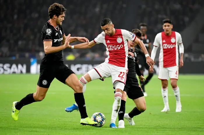 Ajax's Hakim Ziyech in Htion wHh Chelsea's Marcos Alonso and Mason Mount