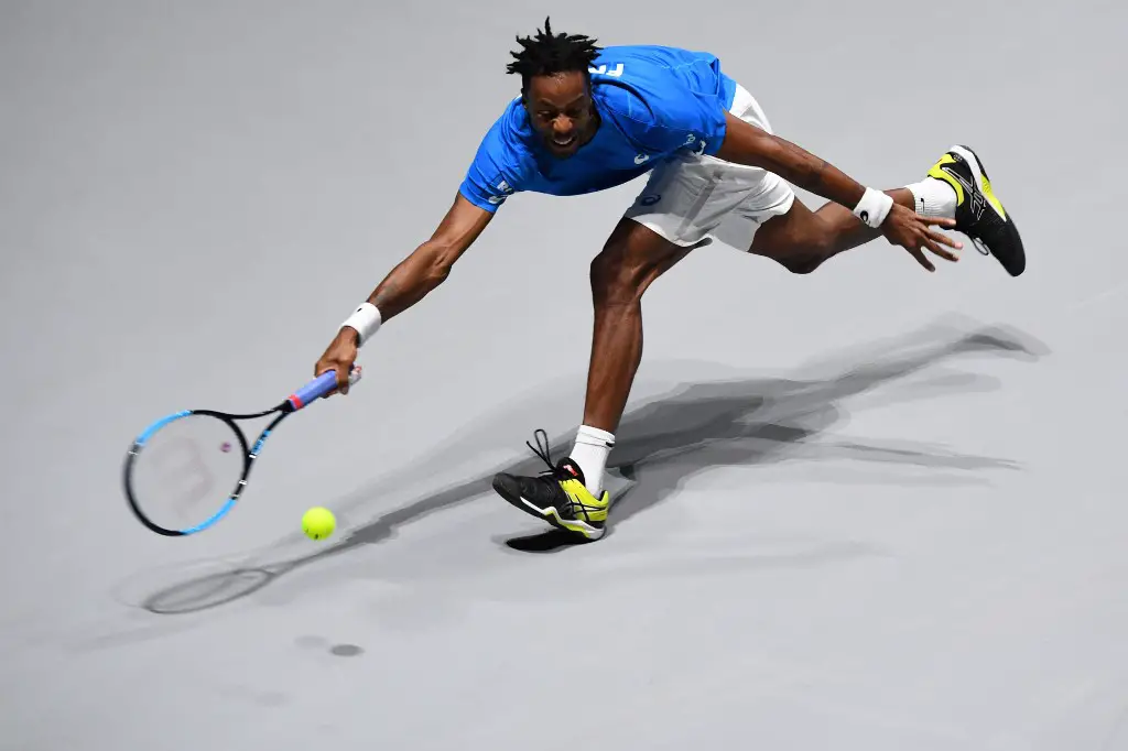 France's Gael Monfils returns the ball to Japan's Yoshihito Nishioka during the singles tennis match between France and Japan at the Davis Cup Madrid Finals 2019 in Madrid on November 19, 2019. (Photo by GABRIEL BOUYS / AFP)