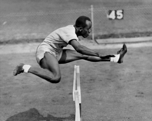 Harrison Dillard jumps a hurdle during his training at the athletics event of the London 1948 Olympic Games, in July 1948 in London. Dillard won gold in the 100 meters dash and 400 meters relay. In the 1952 Olympics, he took two gold medals and he won, during the fifties, 82 races in a row. (Photo by - / INTERCONTINENTALE / AFP)