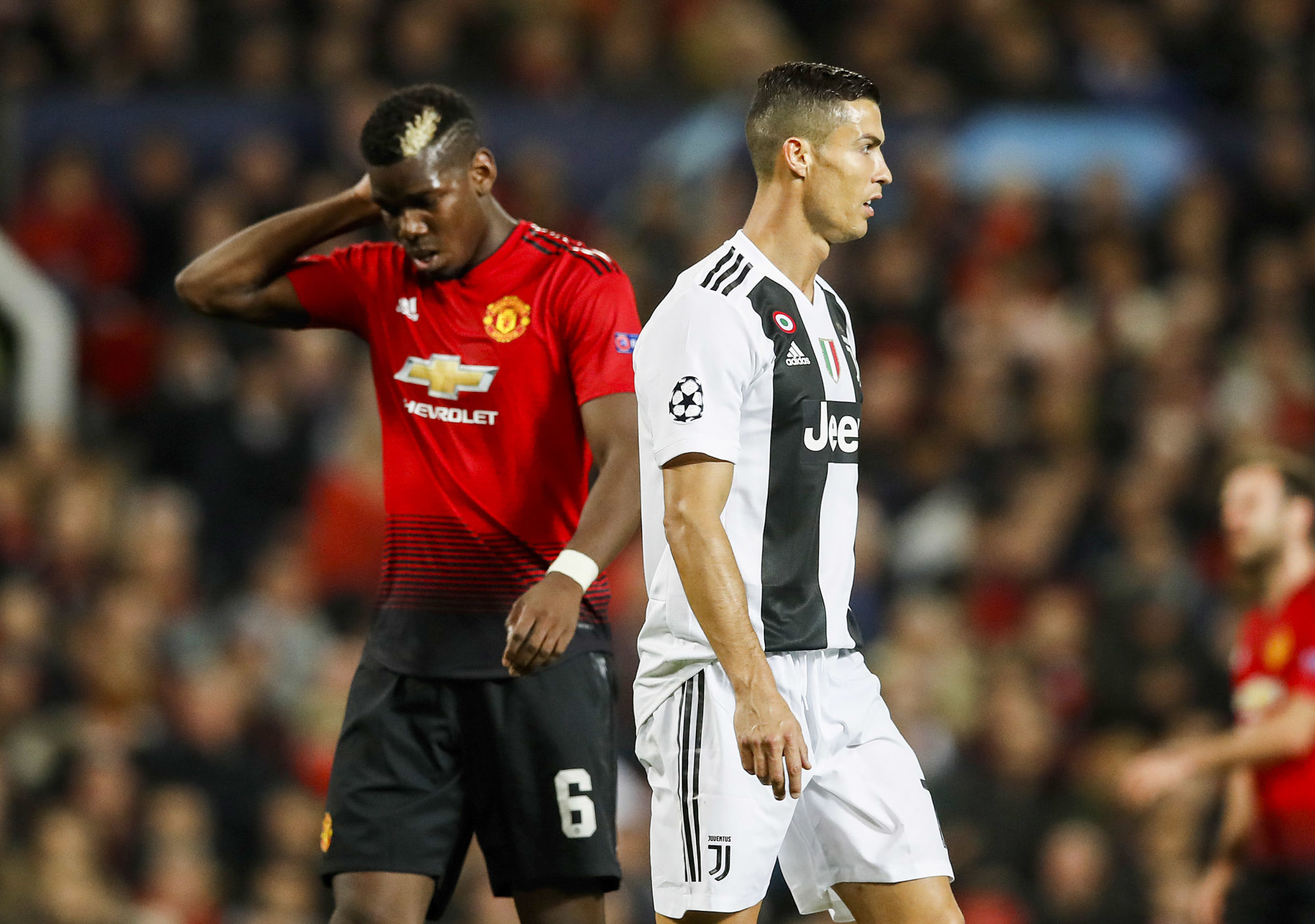 Manchester United's Paul Pogba (left) and Juventus' Cristiano Ronaldo during the UEFA Champions League match between Manchester United and Juventus Fc, at Old Trafford, Manchester, on October 23, 2018. Photo : PA Images / Icon Sport
