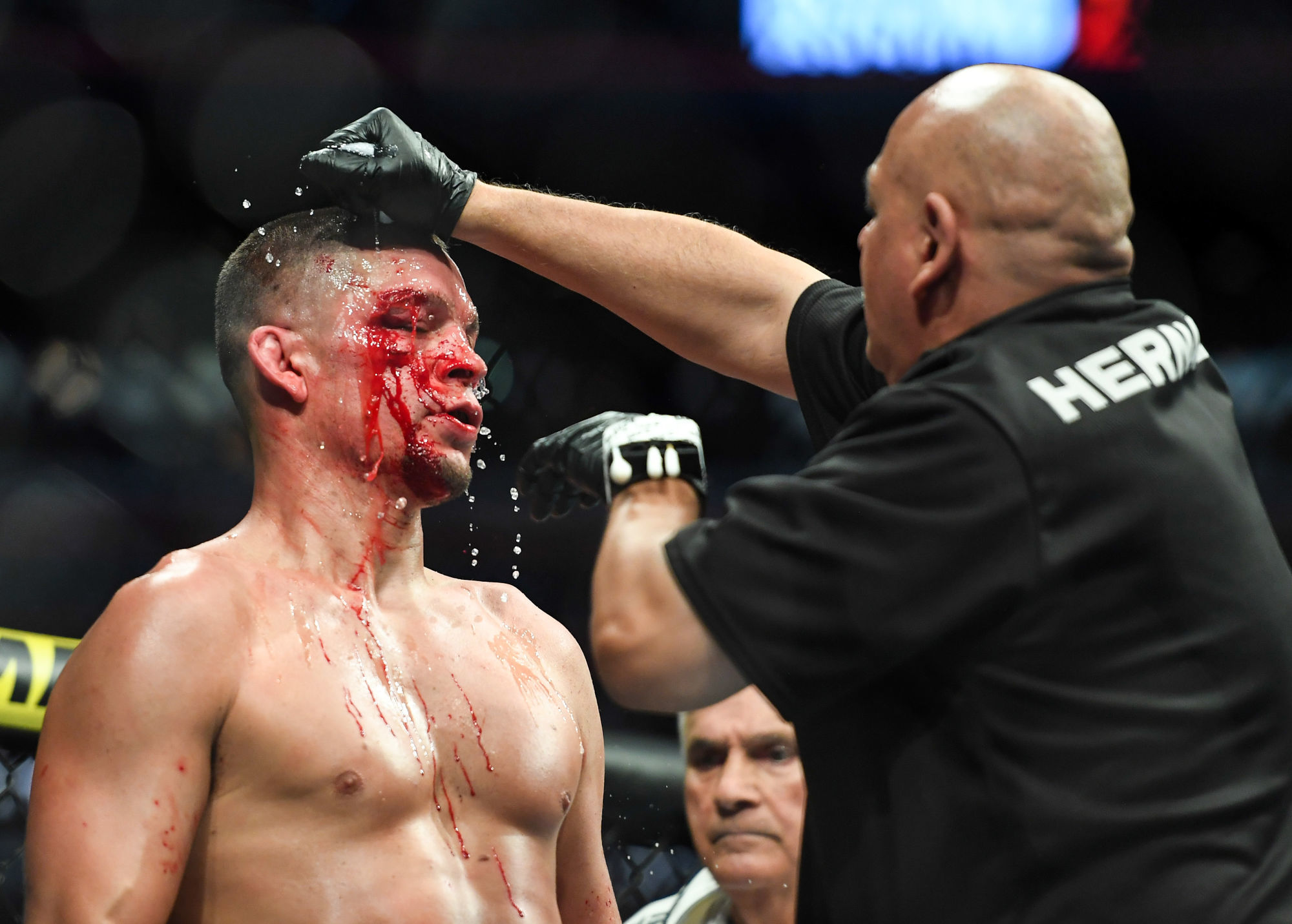 Nov 2, 2019; New York, NY, USA; Nate Diaz (blue gloves) gets treatment during his fight against Jorge Masvidal (red gloves) during UFC 244 at Madison Square Garden. Mandatory Credit: Sarah Stier-USA TODAY Sports/Sipa USA 

Photo by Icon Sport - Nate DIAZ - Madison Square Garden - New York (Etats Unis)