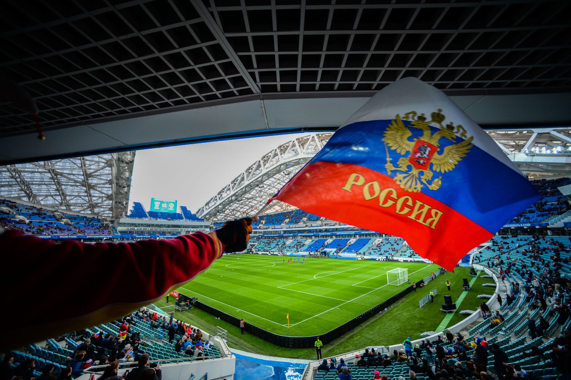 3058911 03/28/2017 A fan waves a Russian flag on the stand of the Fisht Arena prior to the football friendly match between the national teams of Russia and Belgium. Nina Zotina/Sputnik / Icon Sport