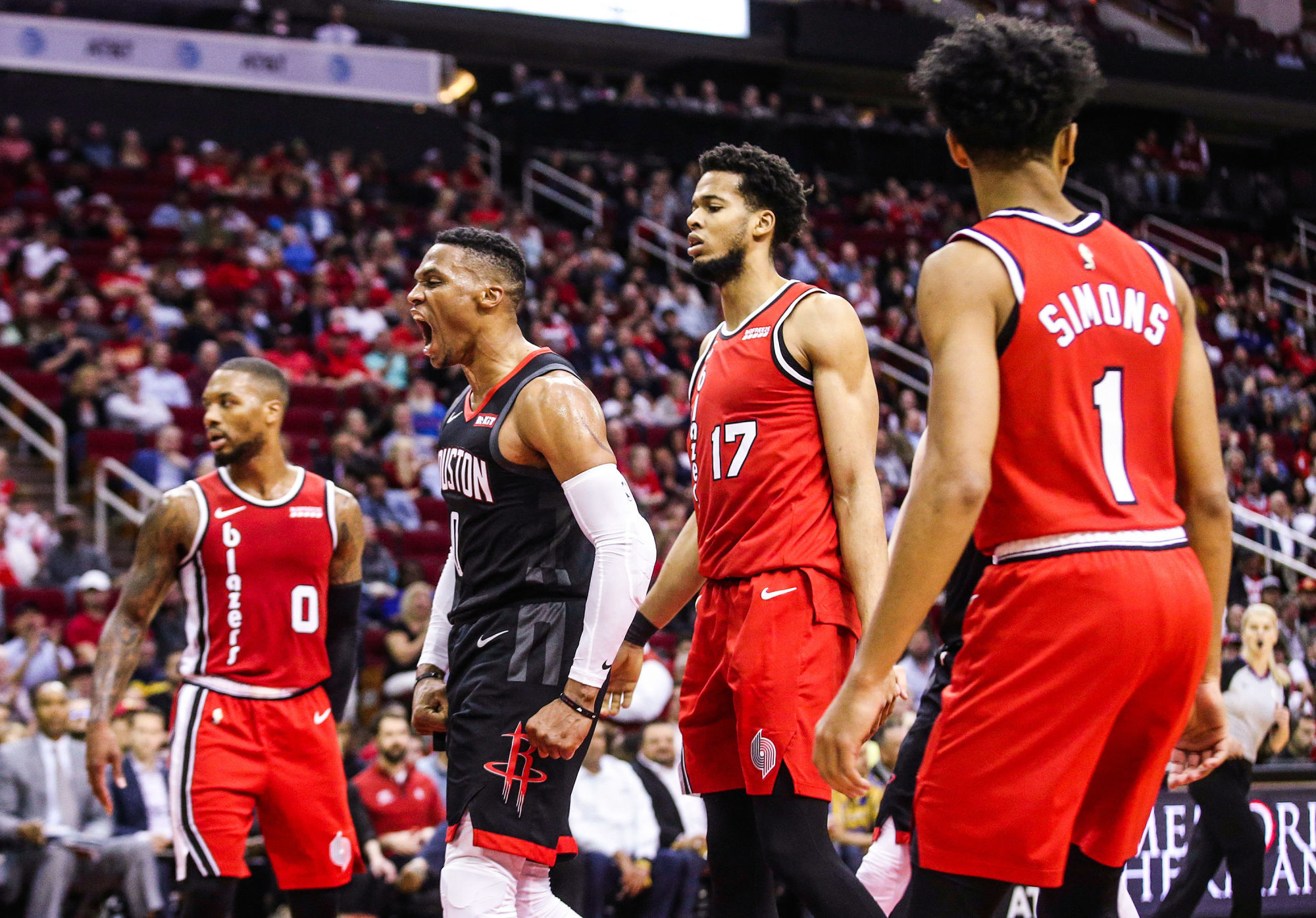 Nov 18, 2019; Houston, TX, USA; Houston Rockets guard Russell Westbrook (0) reacts after making a basket against Portland Trail Blazers guard Damian Lillard (0)  forward Skal Labissiere (17) and guard Anfernee Simons (1) in the second half at Toyota Center. Mandatory Credit: Thomas B. Shea-USA TODAY Sports/Sipa USA 

Photo by Icon Sport - Toyota Center - Houston (Etats Unis)