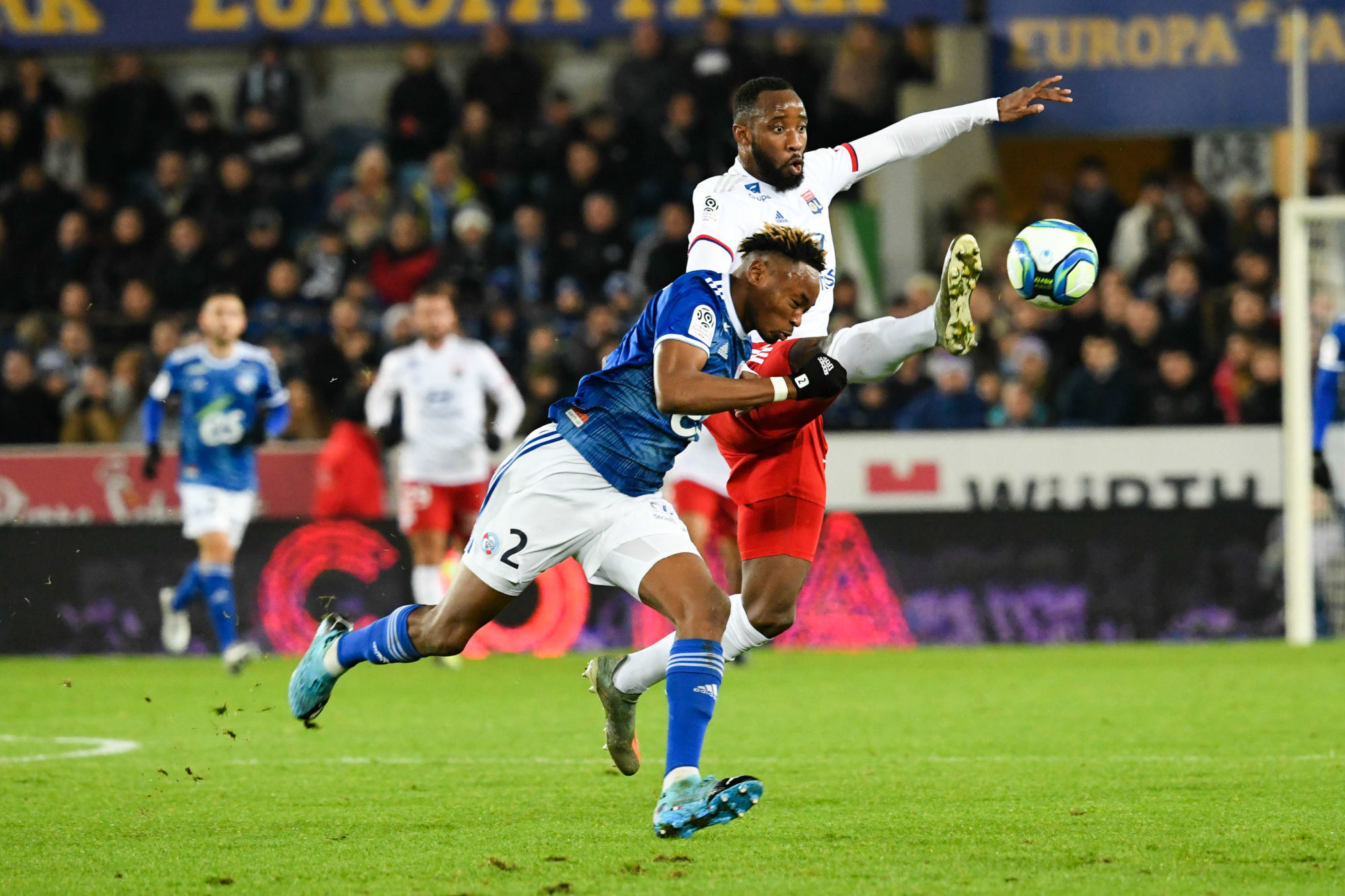 Mohamed SIMAKAN of Strasbourg and Moussa DEMBELE of Lyon during the Ligue 1 match between Strasbourg and Lyon at Stade de la Meinau on November 30, 2019 in Strasbourg, France. (Photo by Sebastien Bozon/Icon Sport) - Stade de la Meinau - Strasbourg (France)