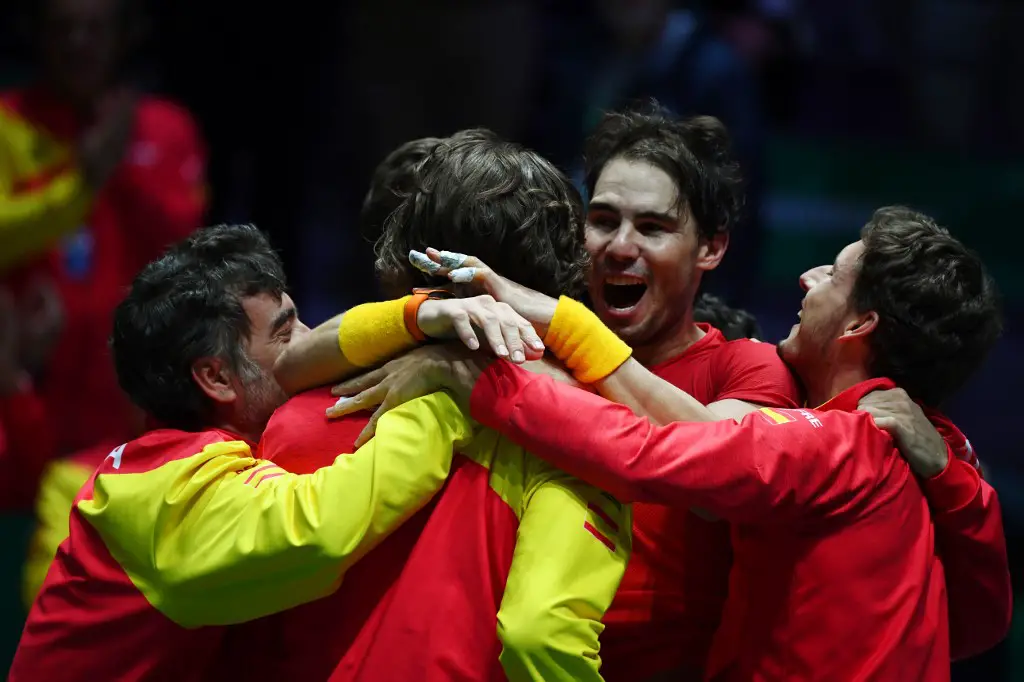 Spain's Rafael Nadal (2R) celebrates with teammates after defeating Canada's Denis Shapovalov during the final singles tennis match between Canada and Spain at the Davis Cup Madrid Finals 2019 in Madrid on November 24, 2019. (Photo by GABRIEL BOUYS / AFP)