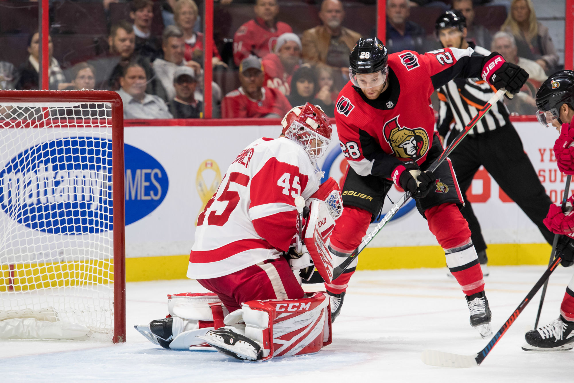 Oct 23, 2019; Ottawa, Ontario, CAN; Detroit Red Wings goalie Jonathan Bernier (45) makes a save in front of Ottawa Senators right wing Connor Brown (28) in the second period at the Canadian Tire Centre. Mandatory Credit: Marc DesRosiers-USA TODAY Sports 

Photo by Icon Sport - Jonathan BERNIER - Connor BROWN - Ottawa Senators - Ottawa (Canada)