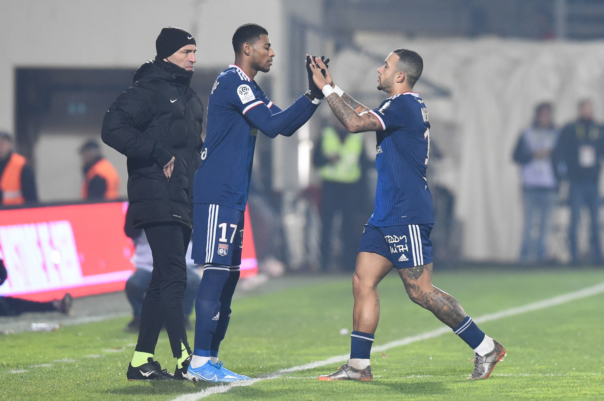 Jeff REINE-ADELAIDE of Lyon and Memphis DEPAY of Lyon  during the Ligue 1 match between Nimes and Lyon on December 6, 2019 in Nimes, France. (Photo by Alexandre Dimou/Icon Sport) - Memphis DEPAY - Jeff REINE-ADELAIDE - Stade des Costières - Nimes (France)
