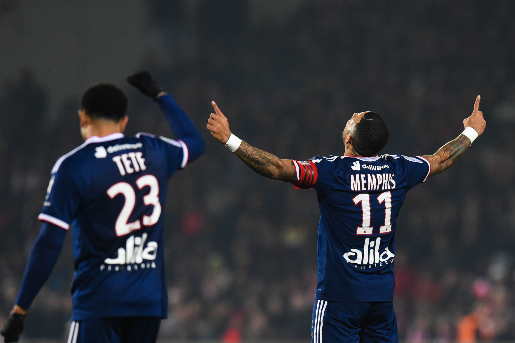 Memphis DEPAY of Lyon celebrates  his second goal  during the Ligue 1 match between Nimes and Lyon on December 6, 2019 in Nimes, France. (Photo by Alexandre Dimou/Icon Sport) - Kenny TETE - Memphis DEPAY - Stade des Costières - Nimes (France)