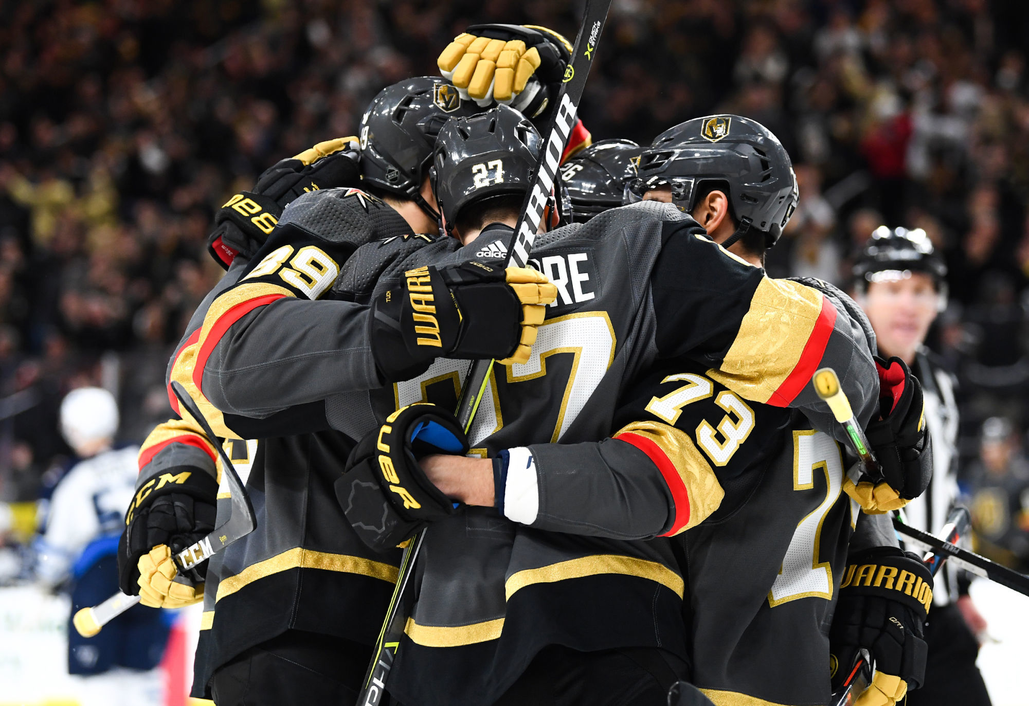 Feb 22, 2019; Las Vegas, NV, USA; Vegas Golden Knights defenseman Shea Theodore (27) celebrates with teammates after scoring a goal during the second period against the Winnipeg Jets at T-Mobile Arena. Photo : SUSA / Icon Sport