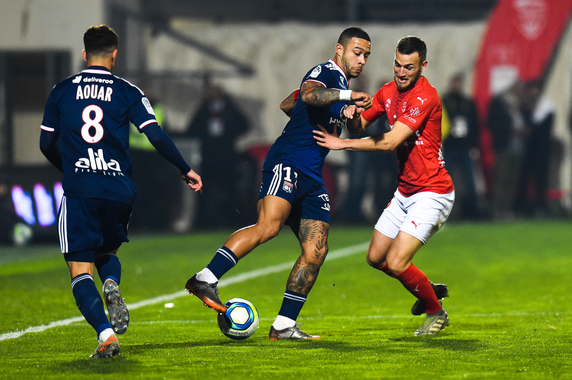 Memphis DEPAY of Lyon and Gaetan PAQUIEZ of Nimes  during the Ligue 1 match between Nimes and Lyon on December 6, 2019 in Nimes, France. (Photo by Alexandre Dimou/Icon Sport) - Stade des Costières - Nimes (France)
