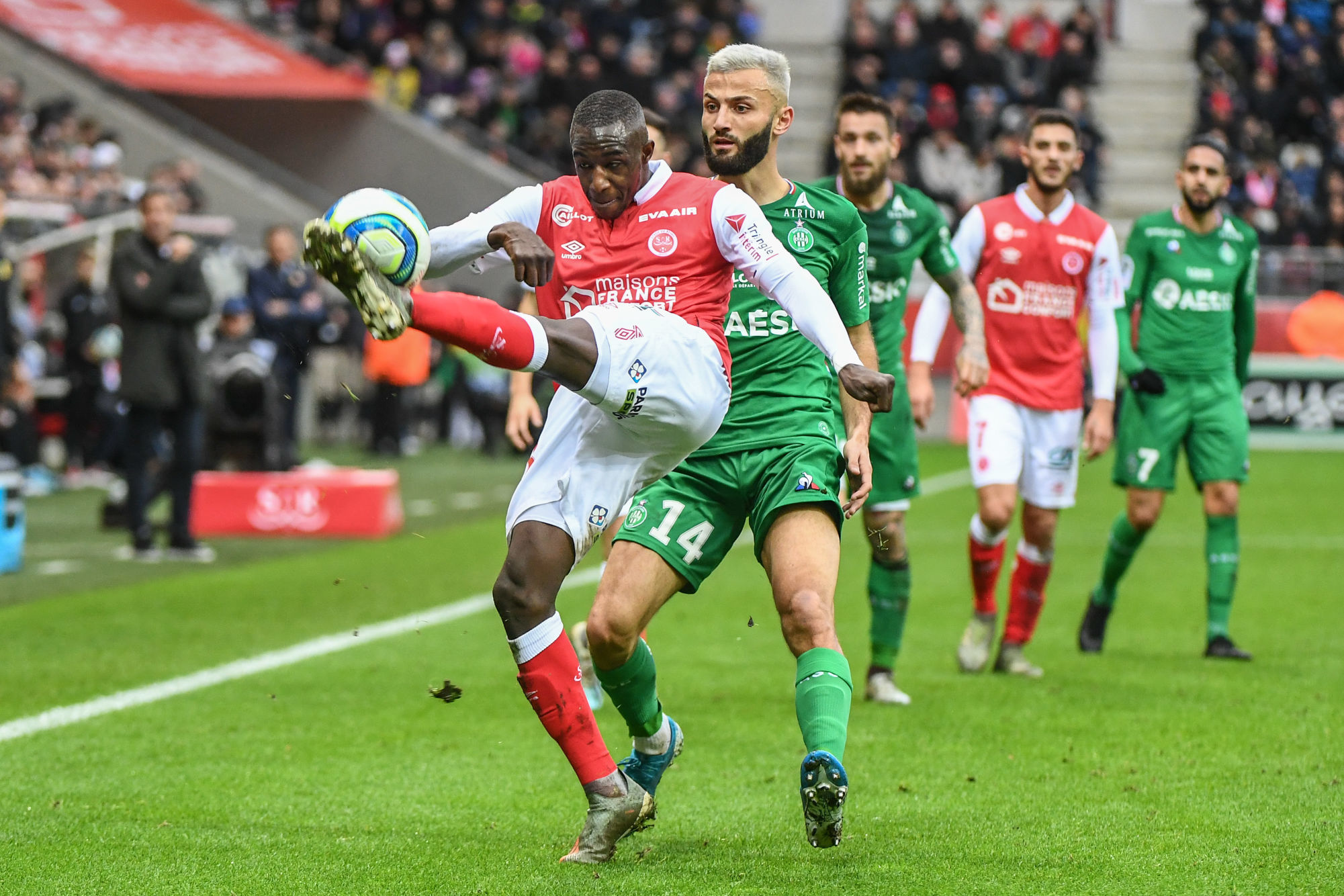 Hassane KAMARA of Reims and Franck HONORAT of Saint Etienne during the Ligue 1 match between Stade Reims and AS Saint-Etienne at Stade Auguste Delaune on December 8, 2019 in Reims, France. (Photo by Anthony Dibon/Icon Sport) - Stade Auguste-Delaune - Reims (France)