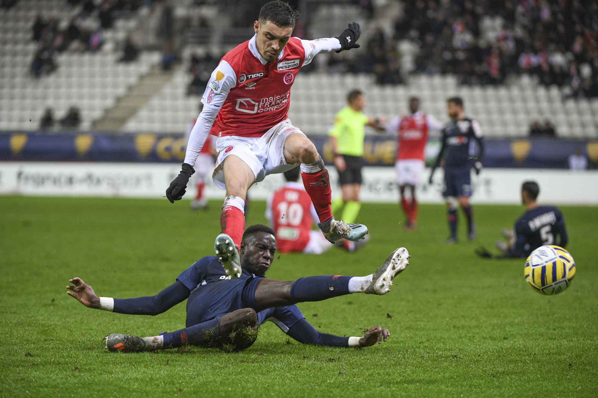 Mathieu CAFARO of Reims and Salomon SAMBIA of Montpellier during the League Cup match between Reims and Montpellier on December 17, 2019 in Reims, France. (Photo by Aude Alcover/Icon Sport) - Stade Auguste-Delaune - Reims (France)