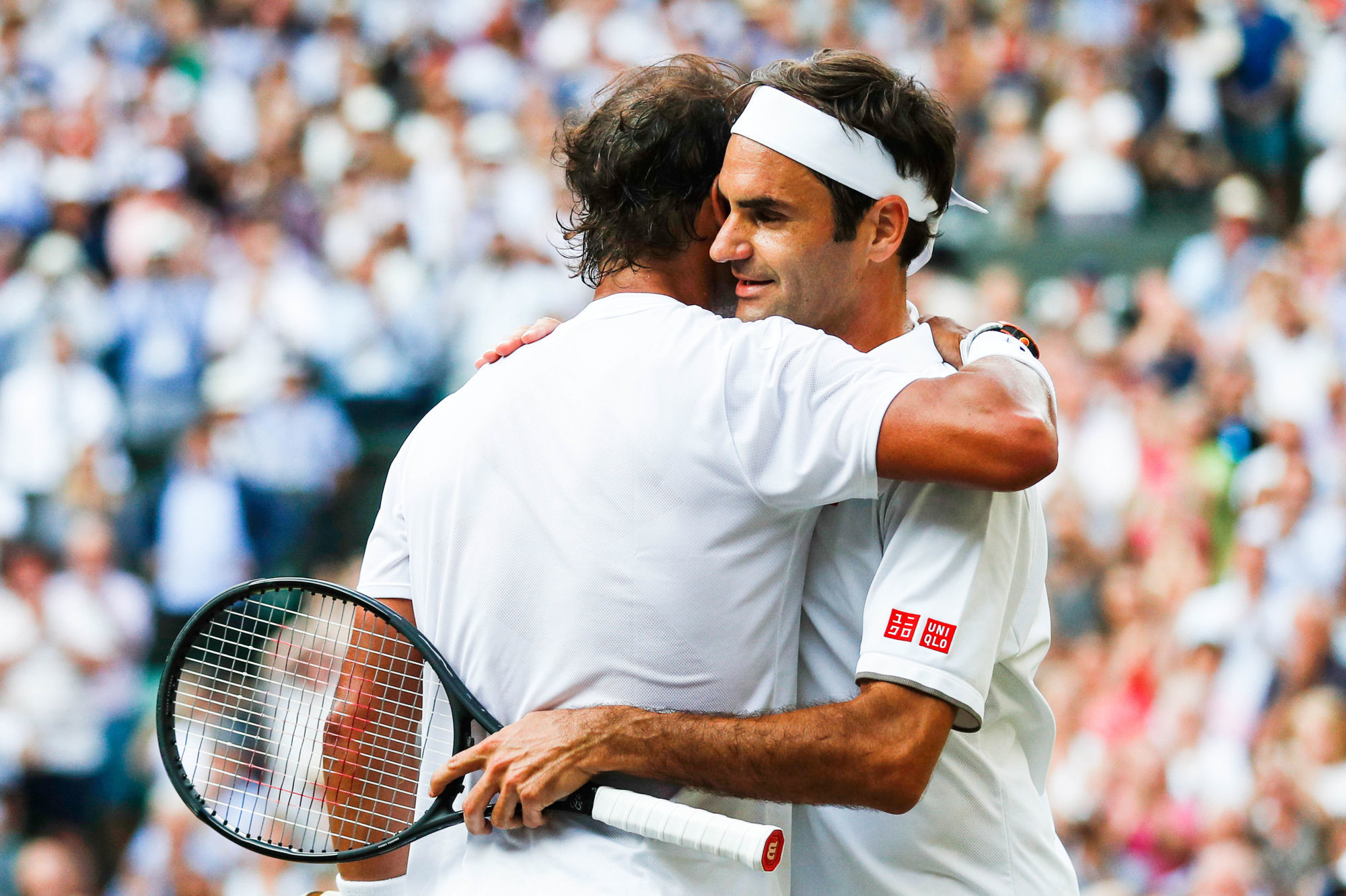 Roger Federer consoles Rafael Nadal on day eleven of the Wimbledon Championships at the All England Lawn Tennis and Croquet Club, Wimbledon on 12th July 2019 Photo : PA Images / Icon Sport