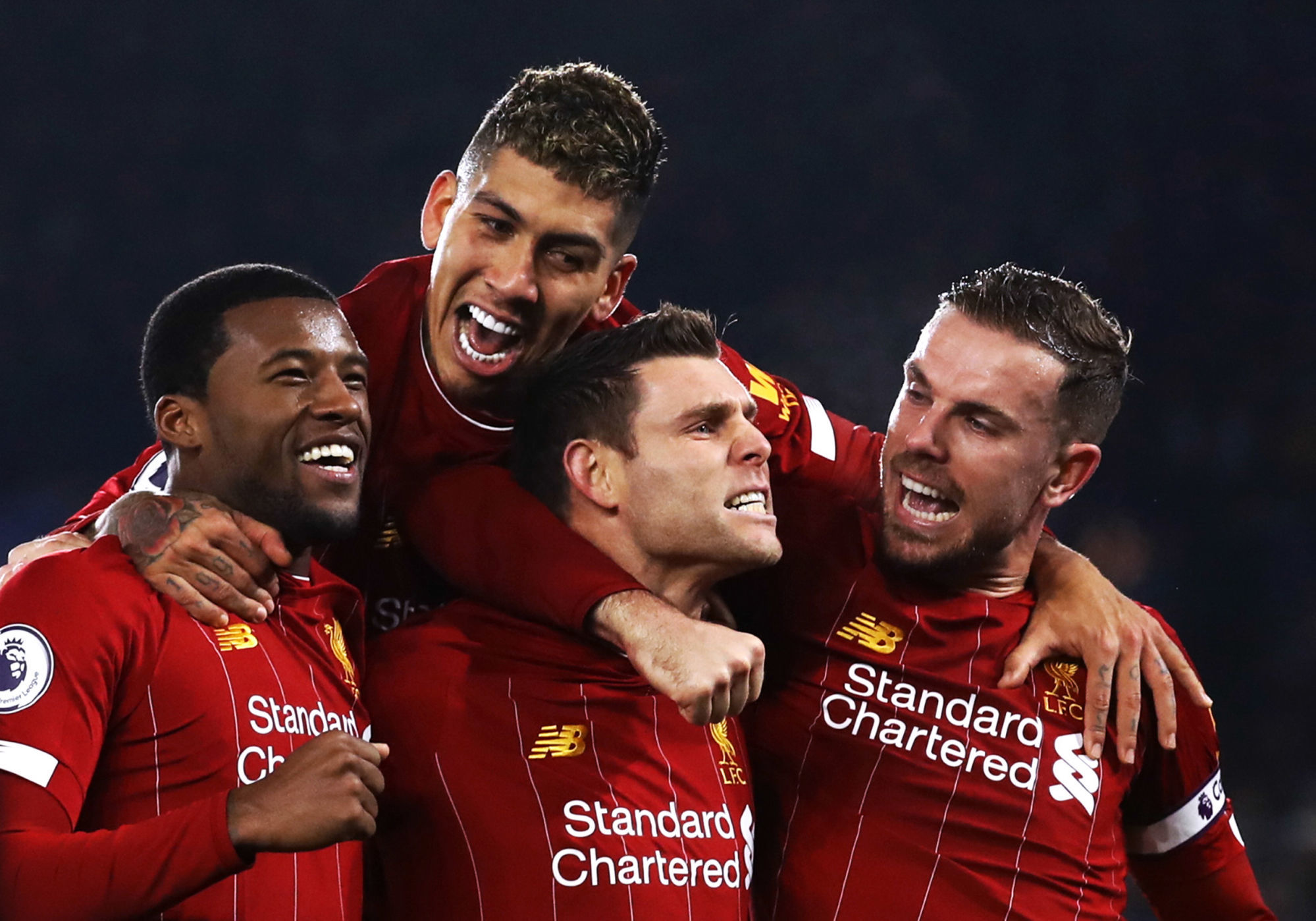 Liverpool's James Milner (centre) celebrates scoring his side's second goal of the game from the penalty spot with team-mates during the Premier League match at the King Power Stadium, Leicester. 

Photo by Icon Sport - Jordan HENDERSON - Roberto FIRMINO - James MILNER - Georginio WIJNALDUM - King Power Stadium  - Leicester (Angleterre)