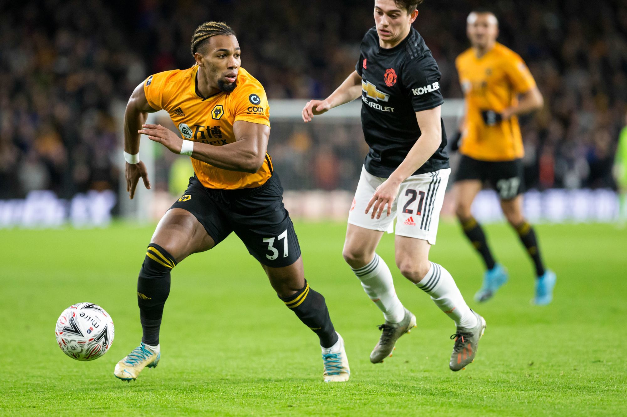 4th January 2020; Molineux Stadium, Wolverhampton, West Midlands, England; English FA Cup Football, Wolverhampton Wanderers versus Manchester United; Adama Traore of Wolverhampton Wanderers looking for a pass as he gets past Daniel James of Manchester United   - Strictly Editorial Use Only. No use with unauthorized audio, video, data, fixture lists, club/league logos or 'live' services. Online in-match use limited to 120 images, no video emulation. No use in betting, games or single club/league/player publications 

Photo by Icon Sport - Daniel JAMES - Adama TRAORE - Molineux Stadium - Wolverhampton (Angleterre)