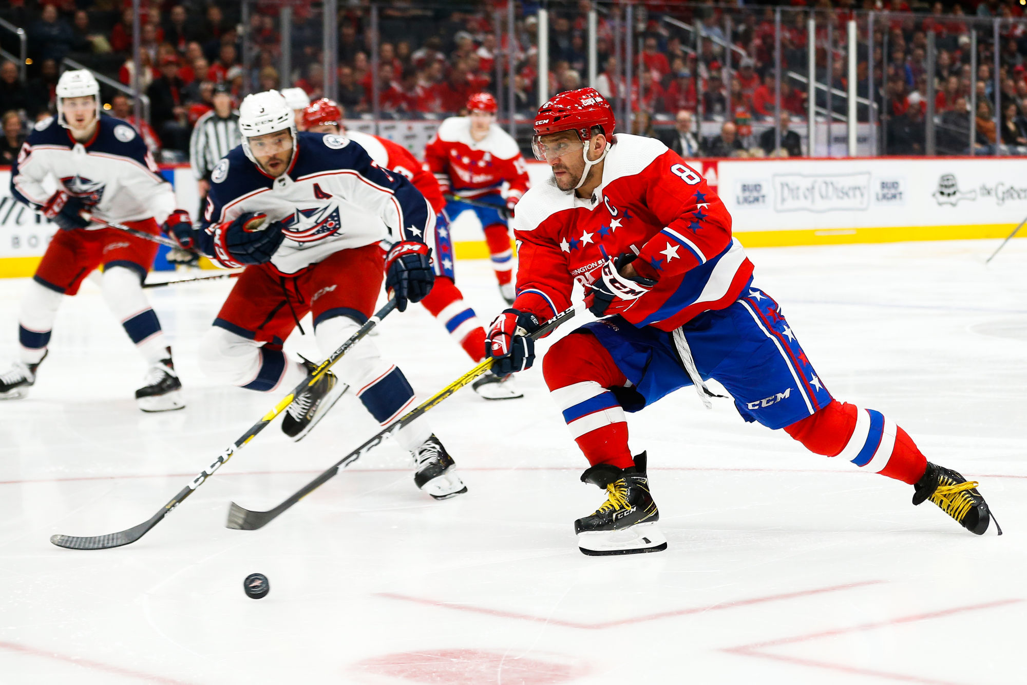 Dec 9, 2019; Washington, DC, USA; Washington Capitals left wing Alex Ovechkin (8) shoots the puck as Columbus Blue Jackets defenseman Seth Jones (3) defends in the second period at Capital One Arena. Mandatory Credit: Geoff Burke-USA TODAY Sports 
Photo by Icon Sport - Seth JONES - Alexander OVECHKIN - AT&T Center - Washington  (Etats Unis)