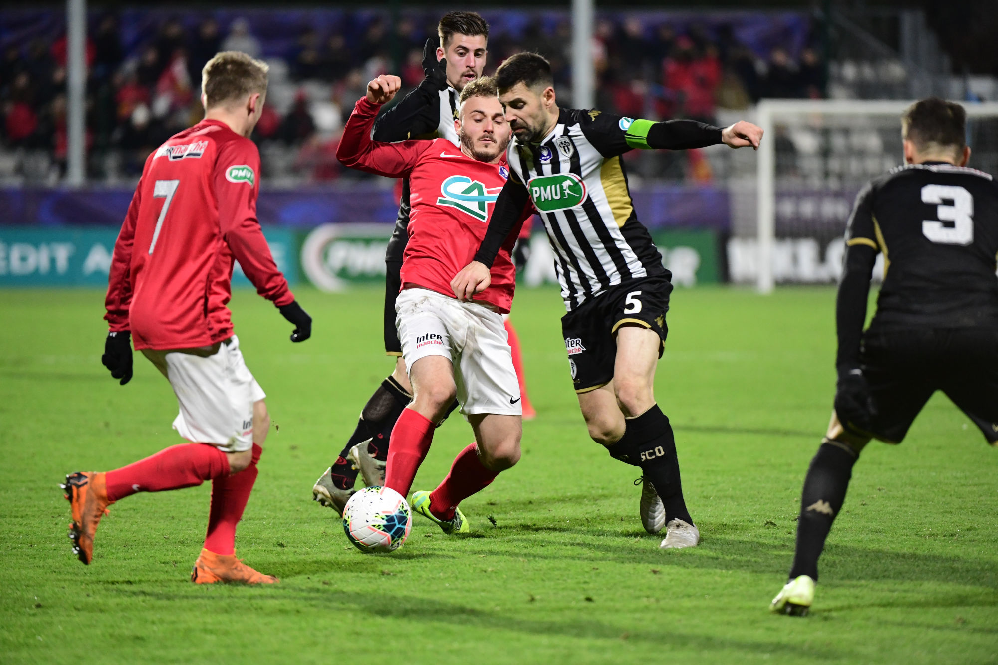 (L-R) Anthony ROGIE of Rouen  and Vincent MANCEAU of Angers during the French Cup match between FC Rouen and Angers on January 19, 2020 in Rouen, France. (Photo by Dave Winter/Icon Sport)