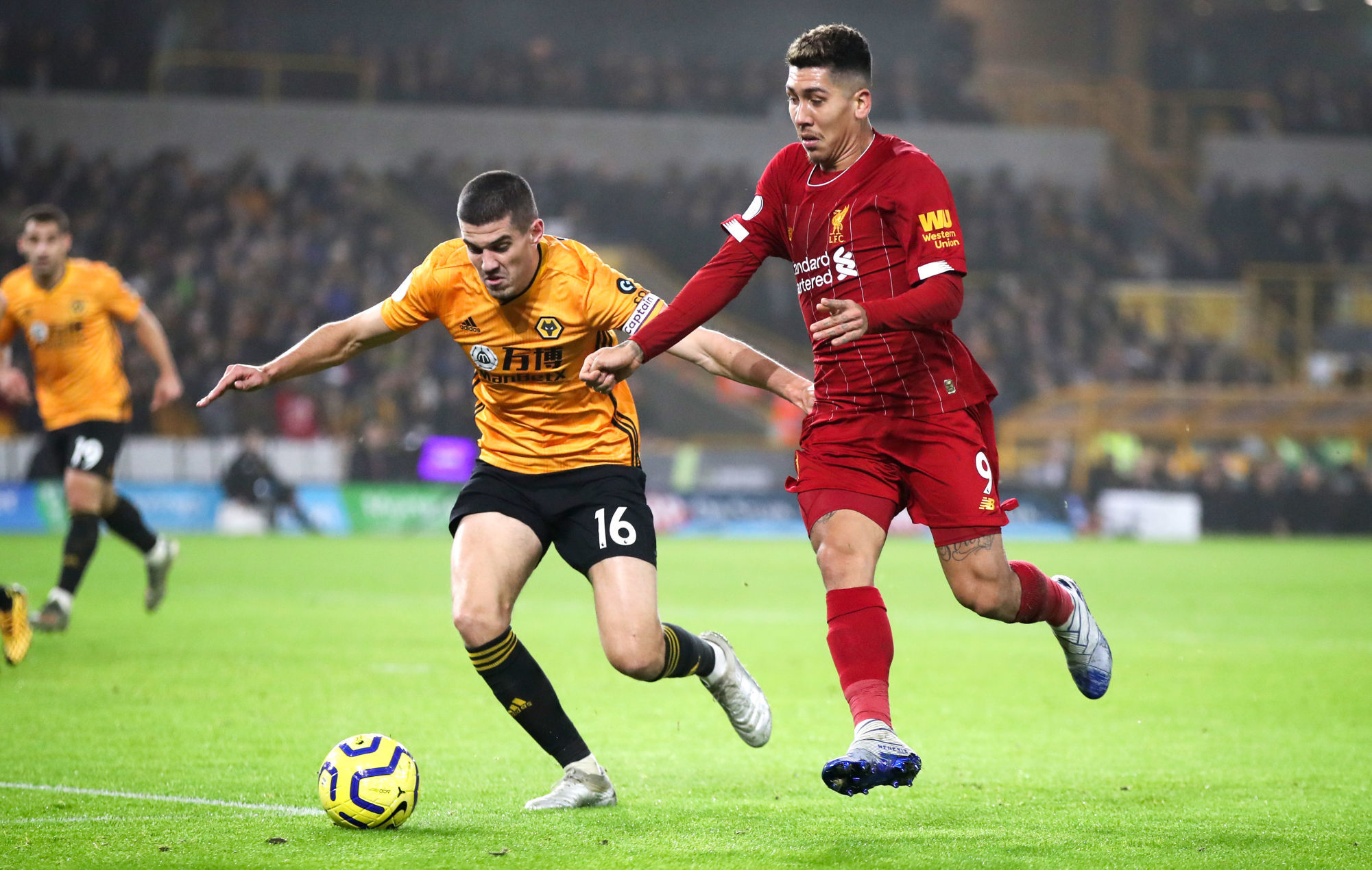 Wolverhampton Wanderers's Conor Coady (left) and Liverpool's Roberto Firmino battle for the ball during the Premier League match at Molineux, Wolverhampton. 
Photo by Icon Sport - Molineux Stadium - Wolverhampton (Angleterre)