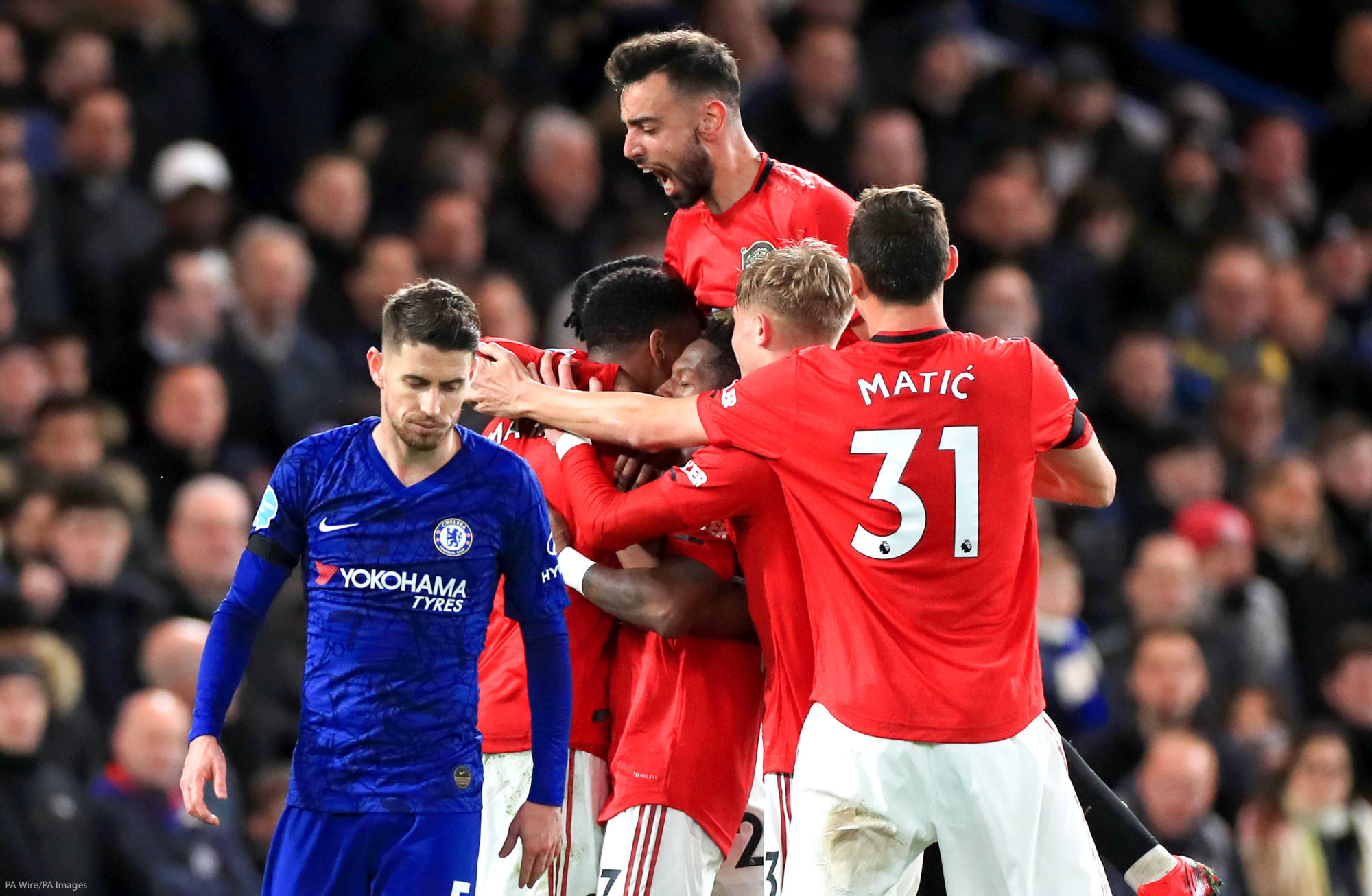 Chelsea's Jorginho appears dejected as Manchester United players celebrate after team mate Anthony Martial (second left) scores their sides first goal of the game during the Premier League match at Stamford Bridge, London. 

Photo by Icon Sport - Stamford Bridge - Londres (Angleterre)