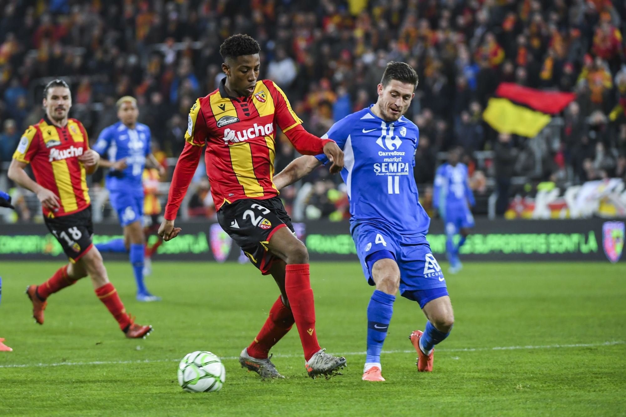 Simon Bokote BANZA of Lens and Eric VANDENABEELE of Grenoble during the Ligue 2 match between RC Lens and Grenoble at Stade Bollaert-Delelis on February 10, 2020 in Lens, France. (Photo by Aude Alcover/Icon Sport) - Stade Bollaert-Delelis - Lens (France)