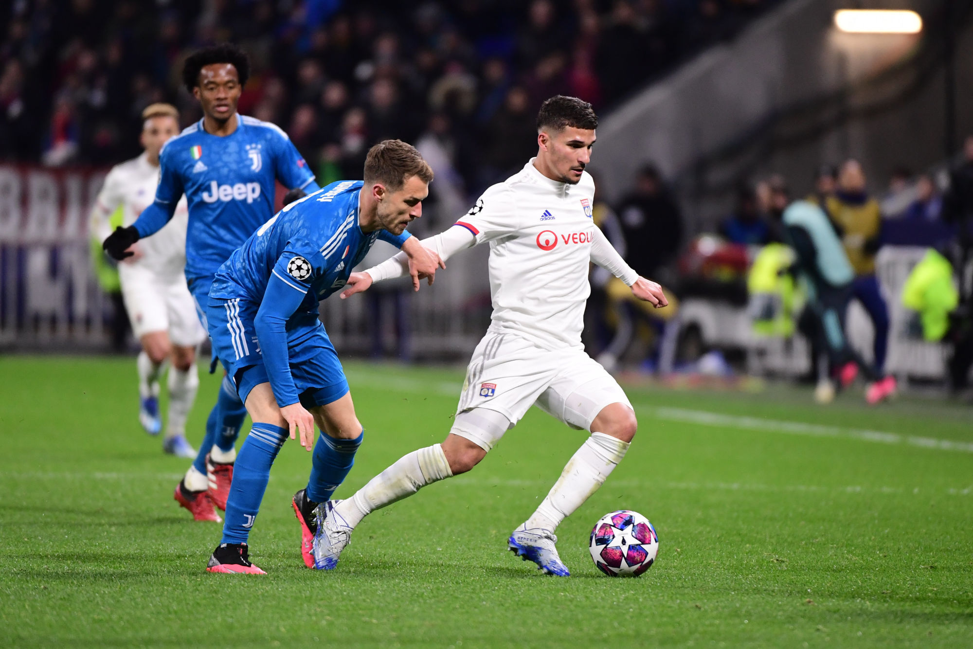 Houssem AOUAR of Lyon during the UEFA Champions League round of 16 first leg match between Lyon and Juventus at Groupama Stadium on February 26, 2020 in Lyon, France. (Photo by Dave Winter/Icon Sport) - Houssem AOUAR - Juan CUADRADO - Groupama Stadium - Lyon (France)