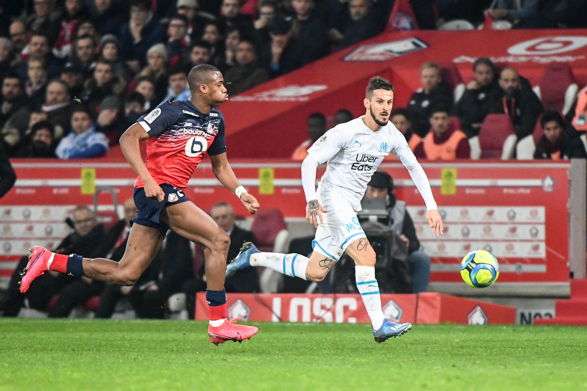 Tiago DJALO of Lille and Dario BENEDETTO of Marseille during the Ligue 1 match between Lille OSC and Olympique Marseille at Stade Pierre Mauroy on February 16, 2020 in Lille, France. (Photo by Anthony Dibon/Icon Sport) - Tiago DJALO - Dario BENEDETTO - Stade Pierre Mauroy - Lille (France)
