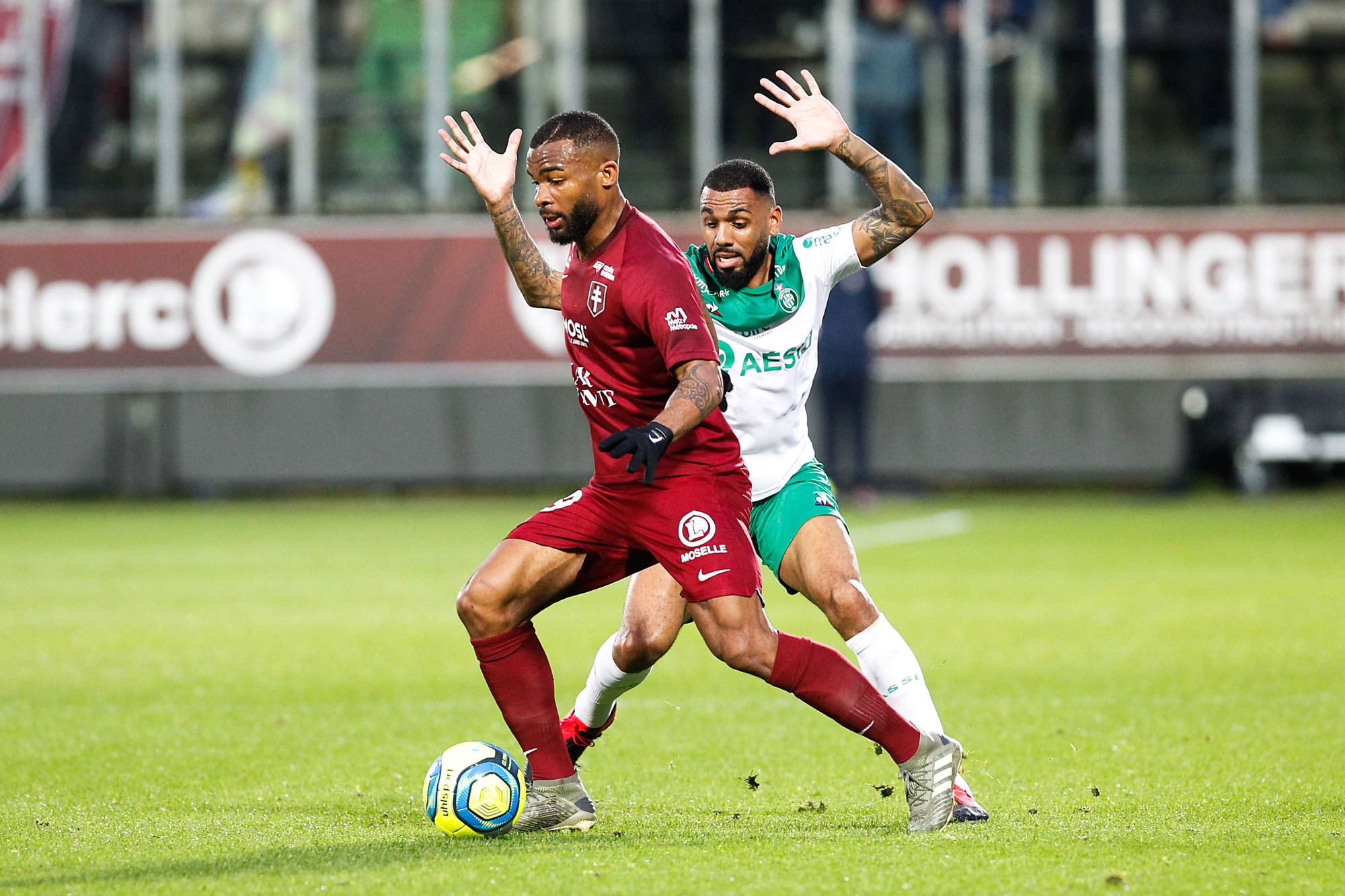 Habib Maiga of Metz and Yann M'Vila of Saint Etienne during the Ligue 1 match between Metz and Saint-Etienne at Stade Saint-Symphorien on February 2, 2020 in Metz, France. (Photo by Fred Marvaux/Icon Sport) - Stade Saint-Symphorien - Metz (France)
