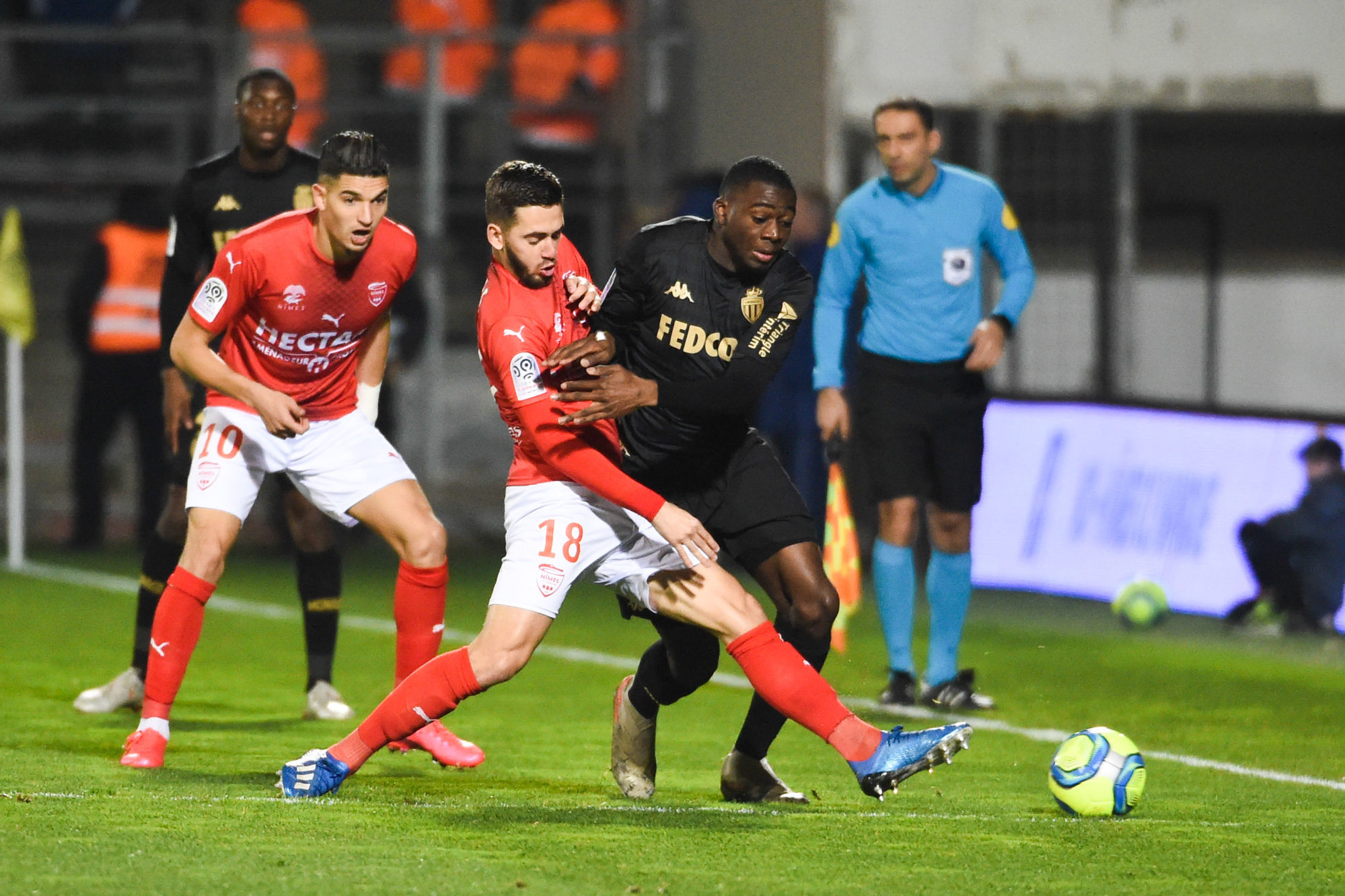 Youssouf FOFANA of Monaco and Theo VALLS of Nimes  during the Ligue 1 match between Nimes and Monaco at Stade des Costieres on February 1, 2020 in Nimes, France. (Photo by Alexandre Dimou/Icon Sport) - Stade des Costières - Nimes (France)