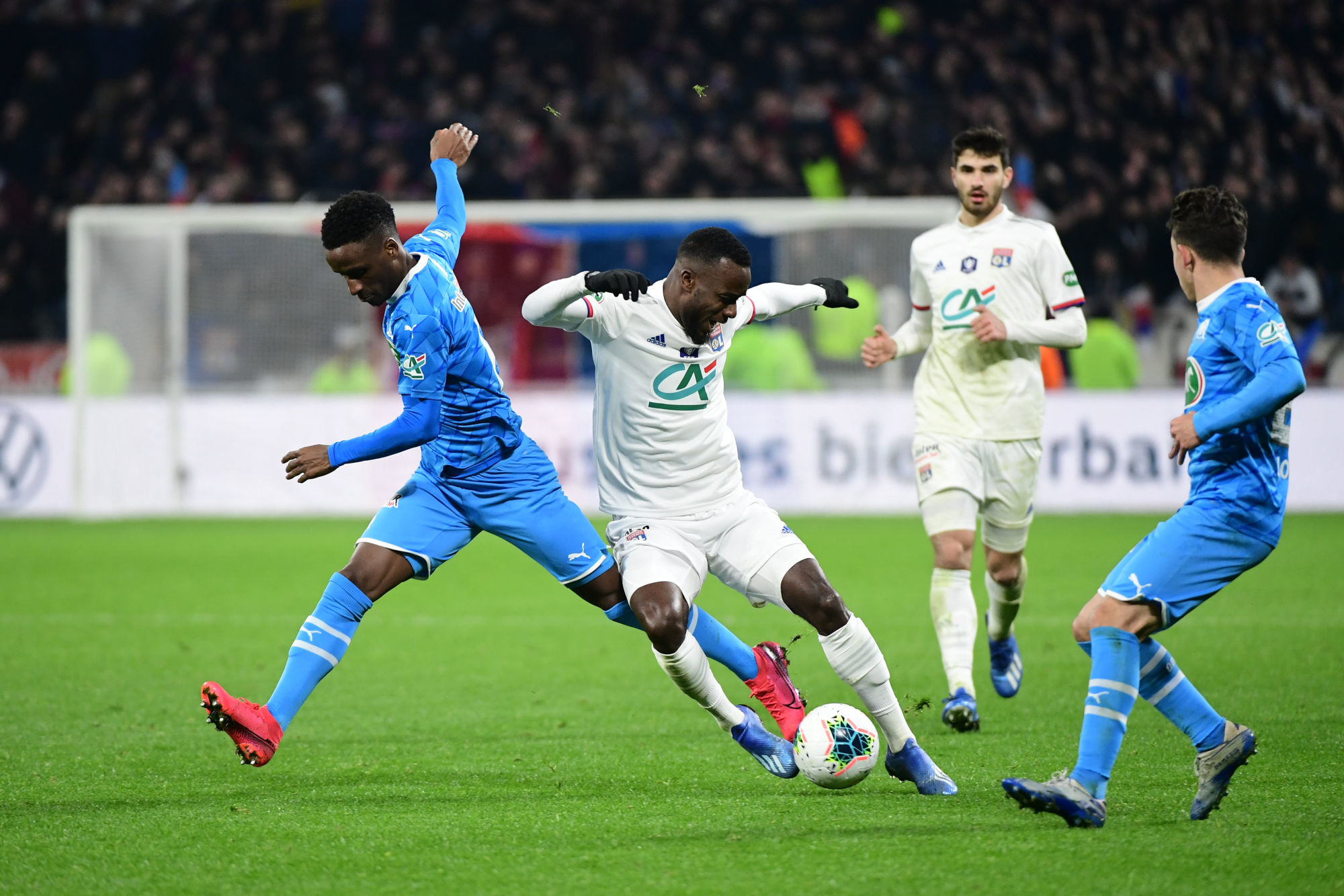 (R-L) Maxwell CORNET of Lyon and Bouna SARR of Marseille during the French Cup quarter-final between Lyon and Marseille at Groupama Stadium on February 12, 2020 in Lyon, France. (Photo by Dave Winter/Icon Sport) - Groupama Stadium - Lyon (France)