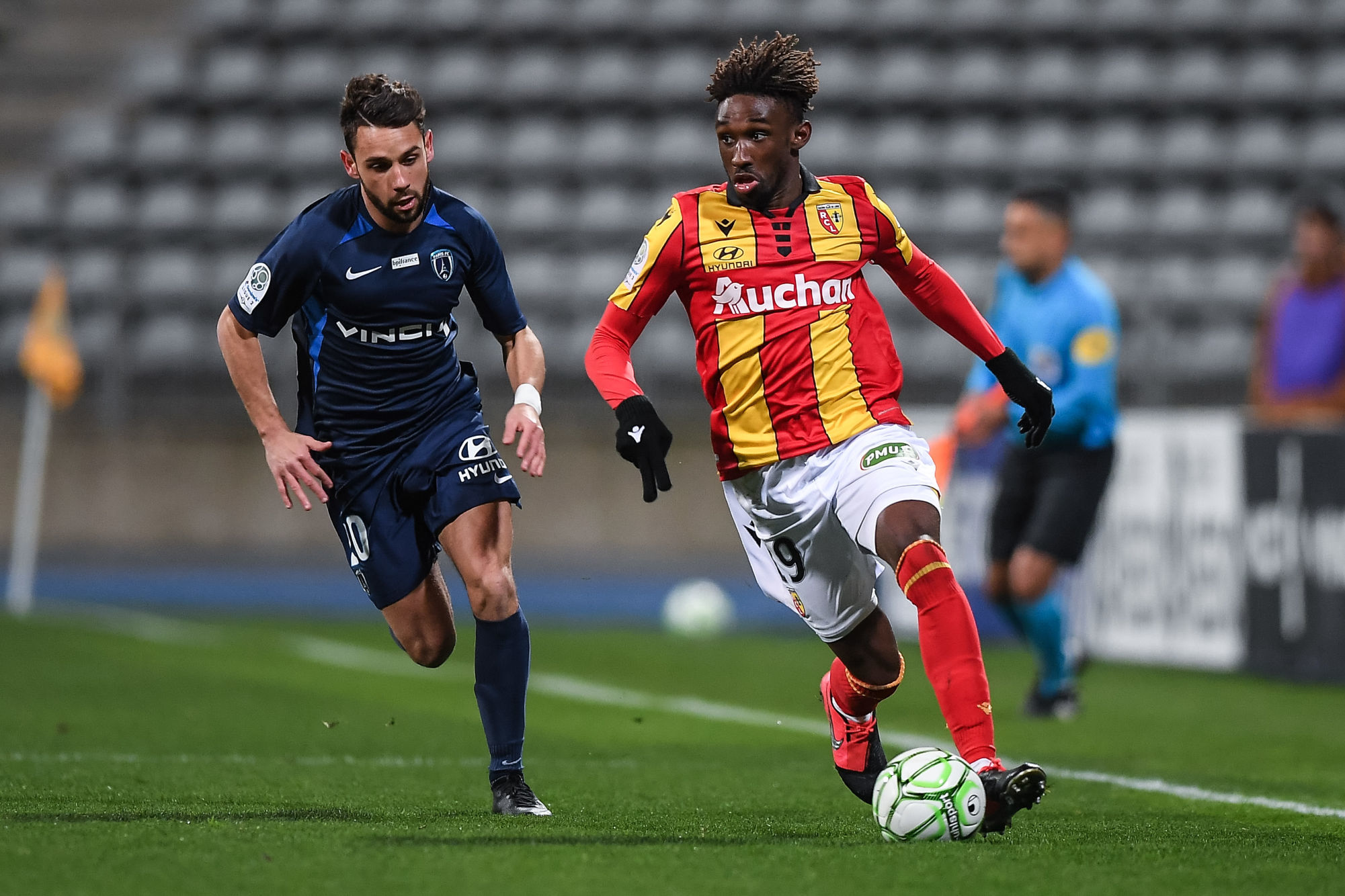 Julien Lopez of Paris FC and Charles BOLI of Lens during the French Ligue 2 Soccer match between Paris FC and Lens at Stade Charlety on March 2, 2020 in Paris, France. (Photo by Baptiste Fernandez/Icon Sport) - Stade Charlety - Paris (France)