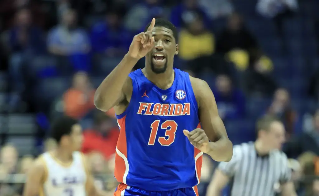 NASHVILLE, TENNESSEE - MARCH 15: Kevarrius Hayes #13 of the Florida Gators celebrates in the game against the LSU Tigers during the Quarterfinals of the SEC Basketball Tournament at Bridgestone Arena on March 15, 2019 in Nashville, Tennessee.   Andy Lyons/Getty Images/AFP