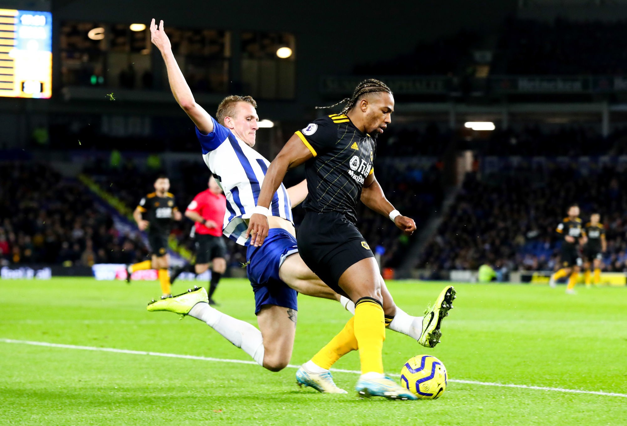 Brighton and Hove Albion's Dan Burn (left) and Wolverhampton Wanderers' Adama Traore battle for the ball during the Premier League match at the Amex Stadium, Brighton. 

Photo by Icon Sport - Adama TRAORE - Dan BURN - Falmer Stadium - Brighton (Angleterre)