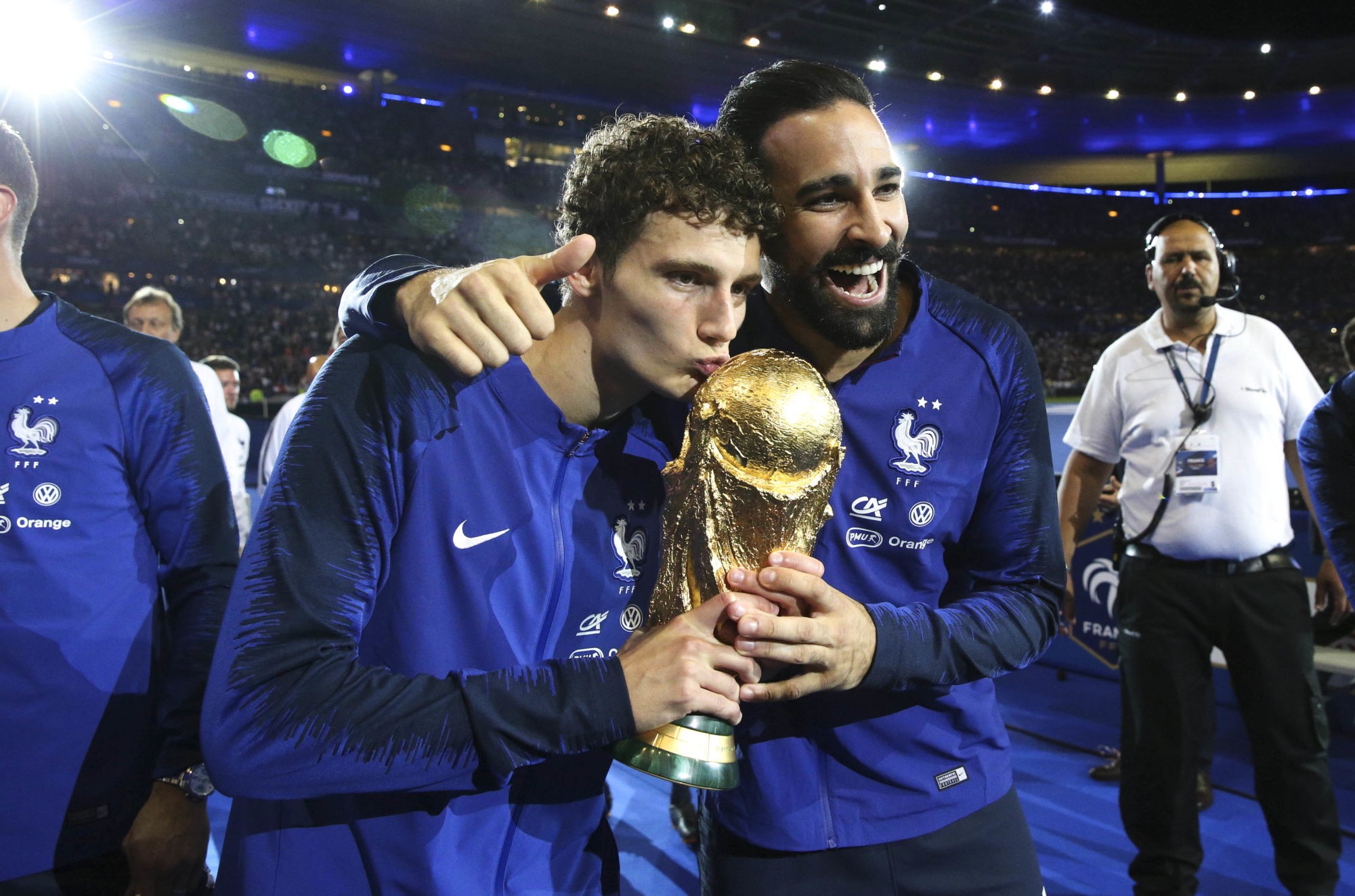 PARIS, FRANCE-SEPTEMBER 09:
Benjamin Pavard and Adil Rami of France celebrate the FIFA World Cup with fan after the UEFA Nations League A group one match between France and Netherlands at Stade de France on September 9, 2018 in Paris, France.
(Photo by Xavier Laine/Pool/Icon Sport)