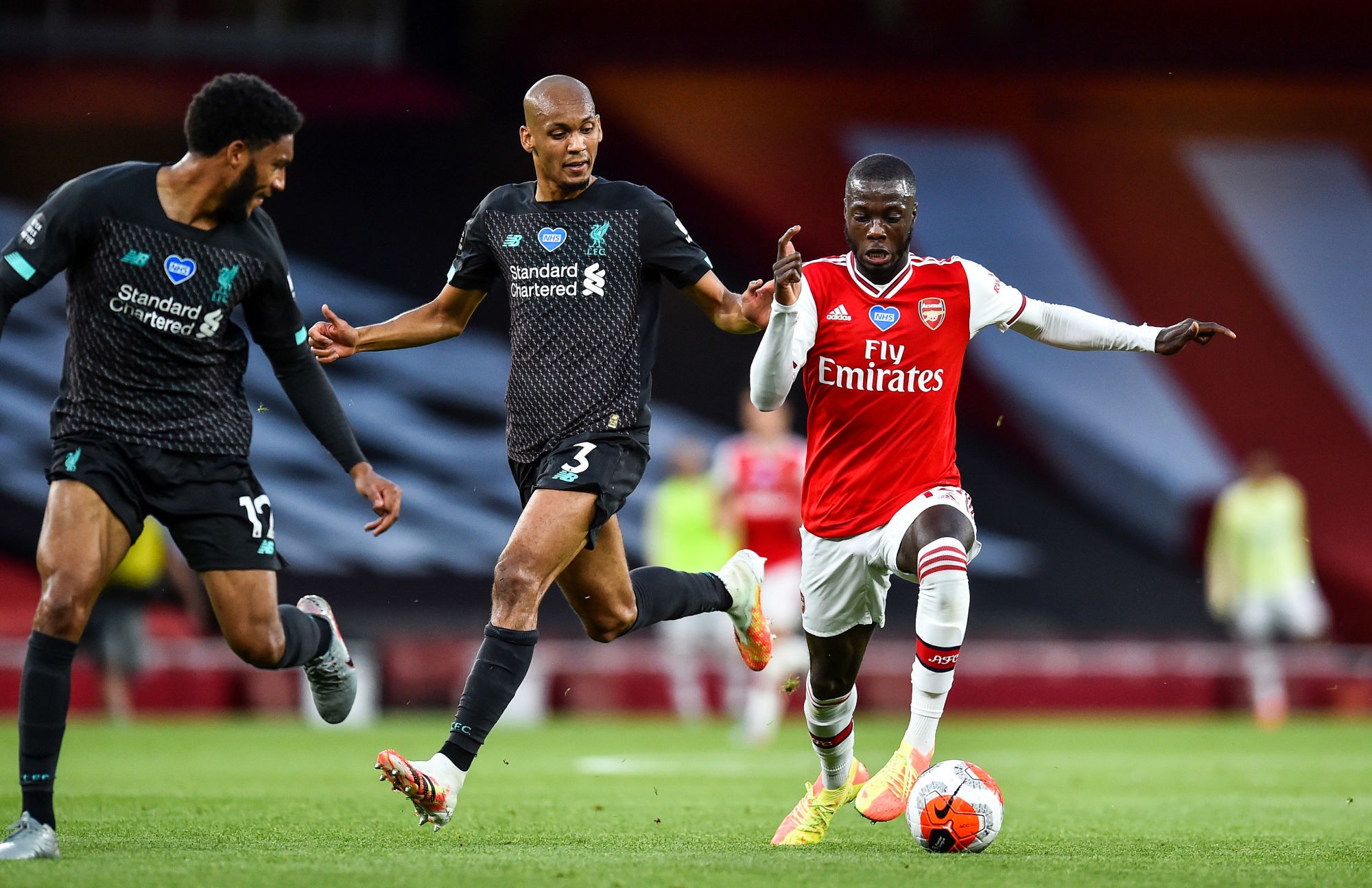 Arsenal's Nicolas Pepe (right) and Liverpool's Fabinho (left) battle for the ball during the Premier League match at the Emirates Stadium, London. 
Photo by Icon Sport - Emirates Stadium - Londres (Angleterre)