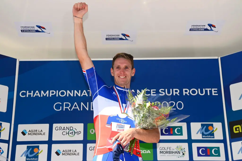 Gold medalist French Arnaud Demare celebrates during the podium ceremony after winning the French Elite men road cycling championship in Grand Champ, western France on August 23, 2020. - Arnaud Demare won the race ahead of Bryan Coquard and Julian Alaphilippe. (Photo by Damien MEYER / AFP)