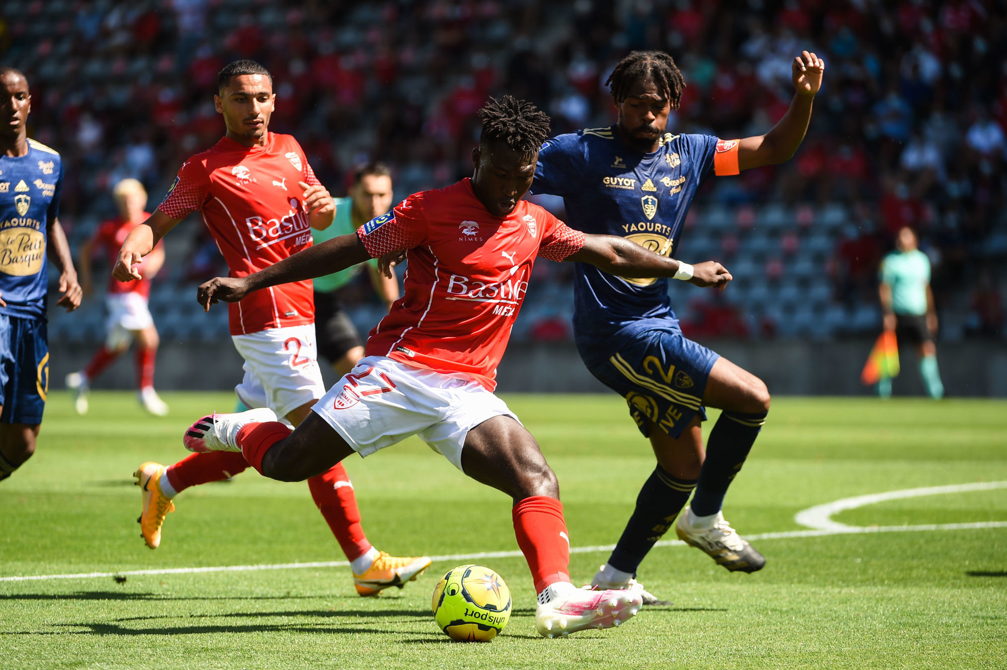 Kevin DENKEY of Nimes and Jean-Kevin DUVERNE of Brest  during the Ligue 1 match between Nimes and Brest on August 23, 2020 in Nimes, France. (Photo by Alexandre Dimou/Icon Sport) - Stade des Costières - Nimes (France)