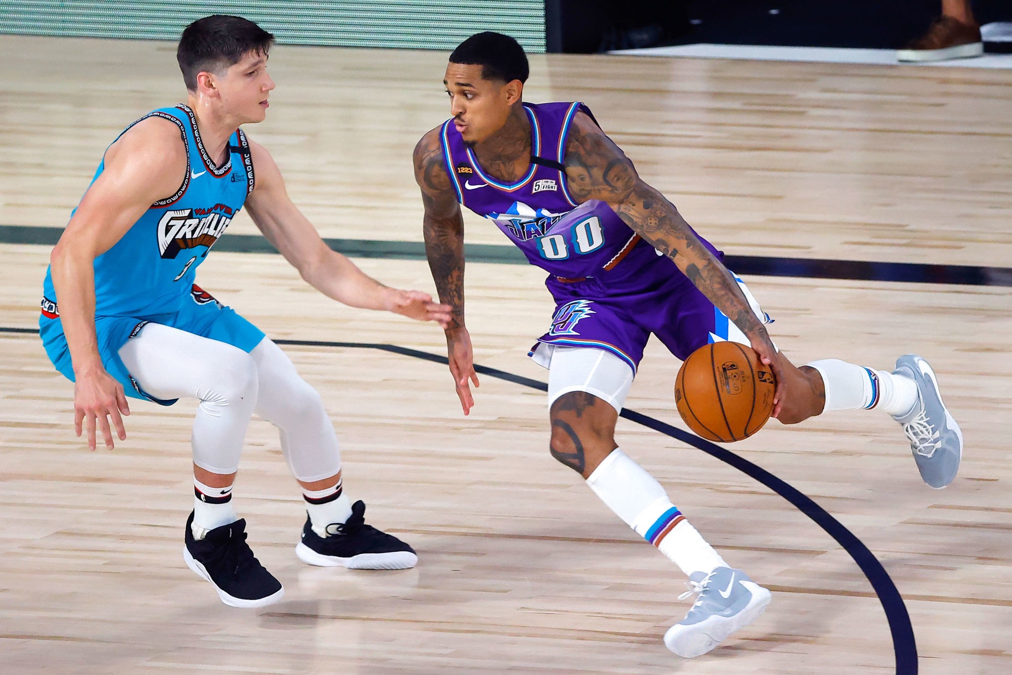 Aug 5, 2020; Lake Buena Vista, Florida, USA; Jordan Clarkson #00 of the Utah Jazz dribbles in front of Grayson Allen #3 of the Memphis Grizzlies during the second half at HP Field House at ESPN Wide World Of Sports Complex on August 5, 2020 in Lake Buena Vista, Florida. Mandatory Credit: Kevin C. Cox/Pool Photo-USA TODAY Sports/Sipa USA 
By Icon Sport -  (Etats Unis)