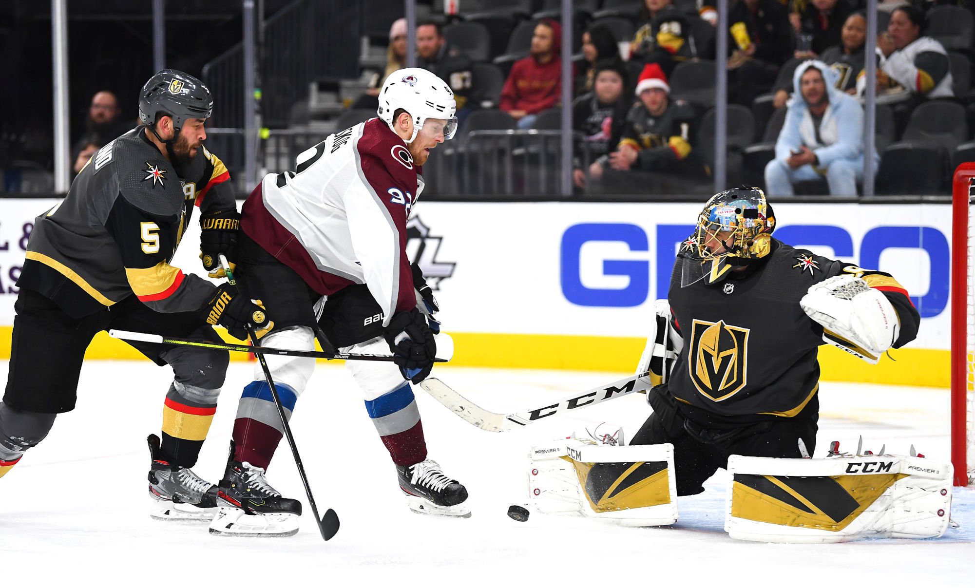 Dec 23, 2019; Las Vegas, Nevada, USA; Vegas Golden Knights goaltender Marc-Andre Fleury (29) makes a save against Colorado Avalanche left wing Gabriel Landeskog (92) as Vegas Golden Knights defenseman Deryk Engelland (5) trails the play during the third period at T-Mobile Arena. Mandatory Credit: Stephen R. Sylvanie-USA TODAY Sports 
Photo by Icon Sport - Marc-Andre FLEURY - Deryk ENGELLAND - Gabriel LANDESKOG