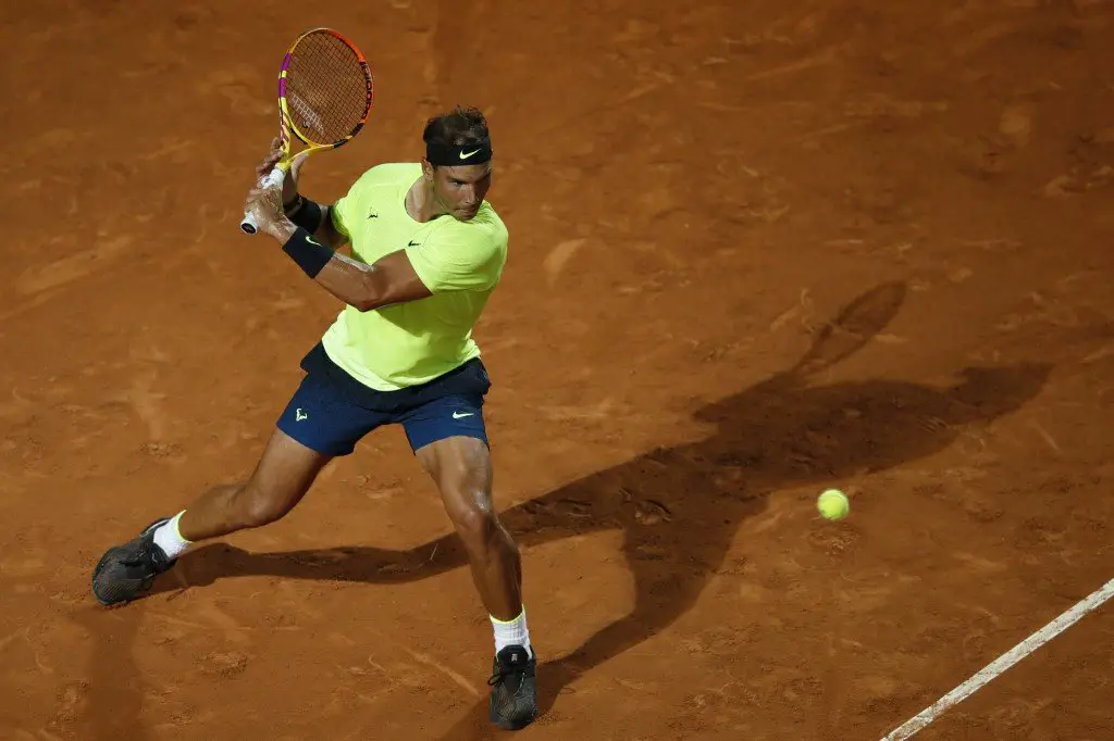 Spain's Rafael Nadal plays a backhand to Spain's Pablo Carreno Busta on day three of the Men's Italian Open at Foro Italico on September 16, 2020 in Rome, Italy. (Photo by Clive Brunskill / POOL / AFP)