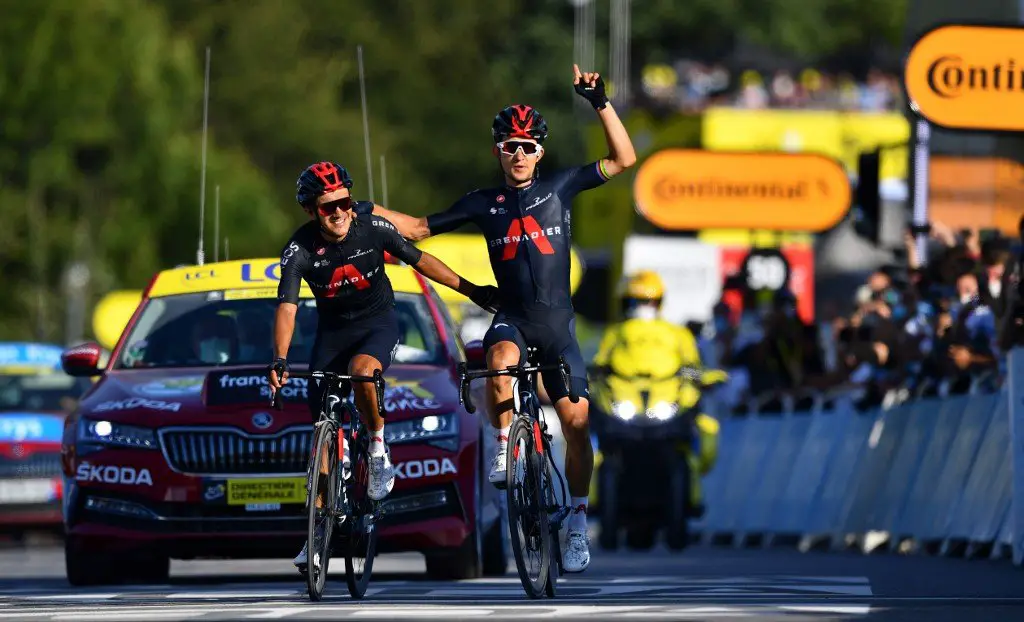 Team Ineos rider Poland's Michal Kwiatkowski (R) celebrates as he crosses the finish line ahead of Team Ineos rider Ecuador's Richard Carapaz during the 18th stage of the 107th edition of the Tour de France cycling race, 168 km between Meribel and La Roche sur Foron, on September 17, 2020. (Photo by Stuart Franklin / POOL / AFP)