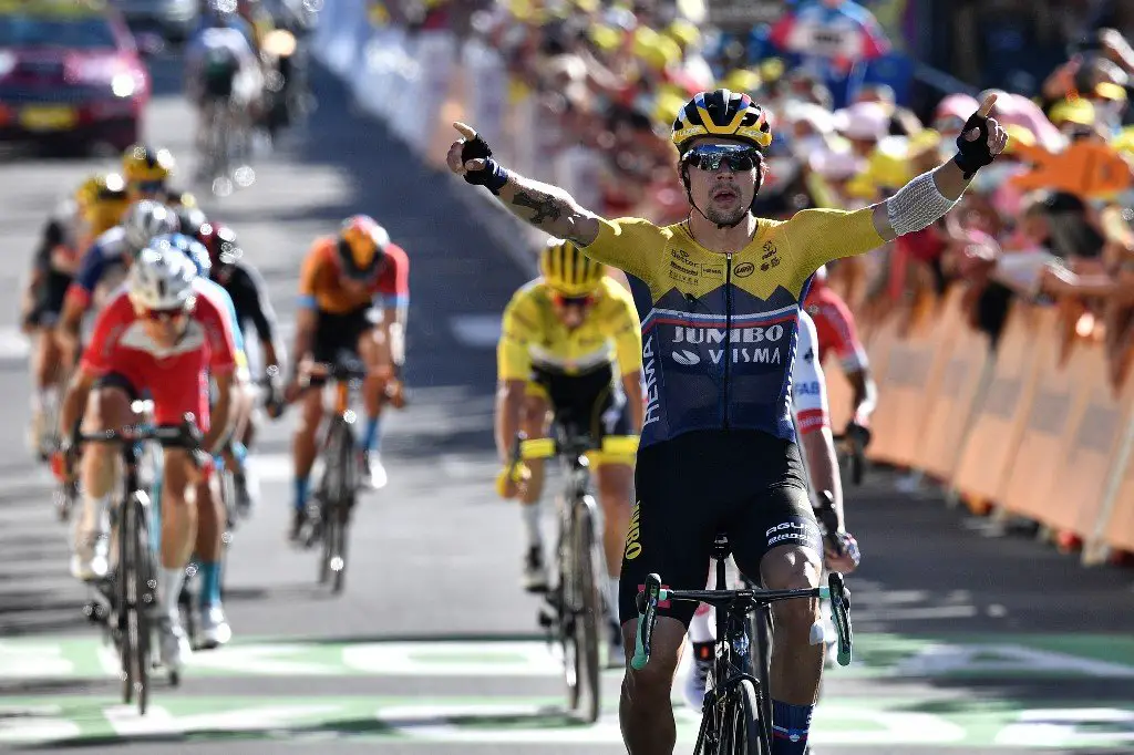 Team Jumbo rider Slovenia's Primoz Roglic celebrates as he crosses the finish line to win the  4th stage of the 107th edition of the Tour de France cycling race, 157 km between Sisteron and Orcieres-Merlette, on September 1, 2020. (Photo by Anne-Christine POUJOULAT / POOL / AFP)