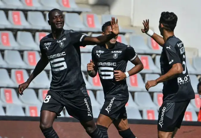 Rennes' French forward Serhou Guirassy (L) celebrates after scoring a goal during the French L1 football match between Nimes and Rennes at the Costieres stadium in Nimes, southern France, on September 13, 2020. / AFP / Pascal GUYOT